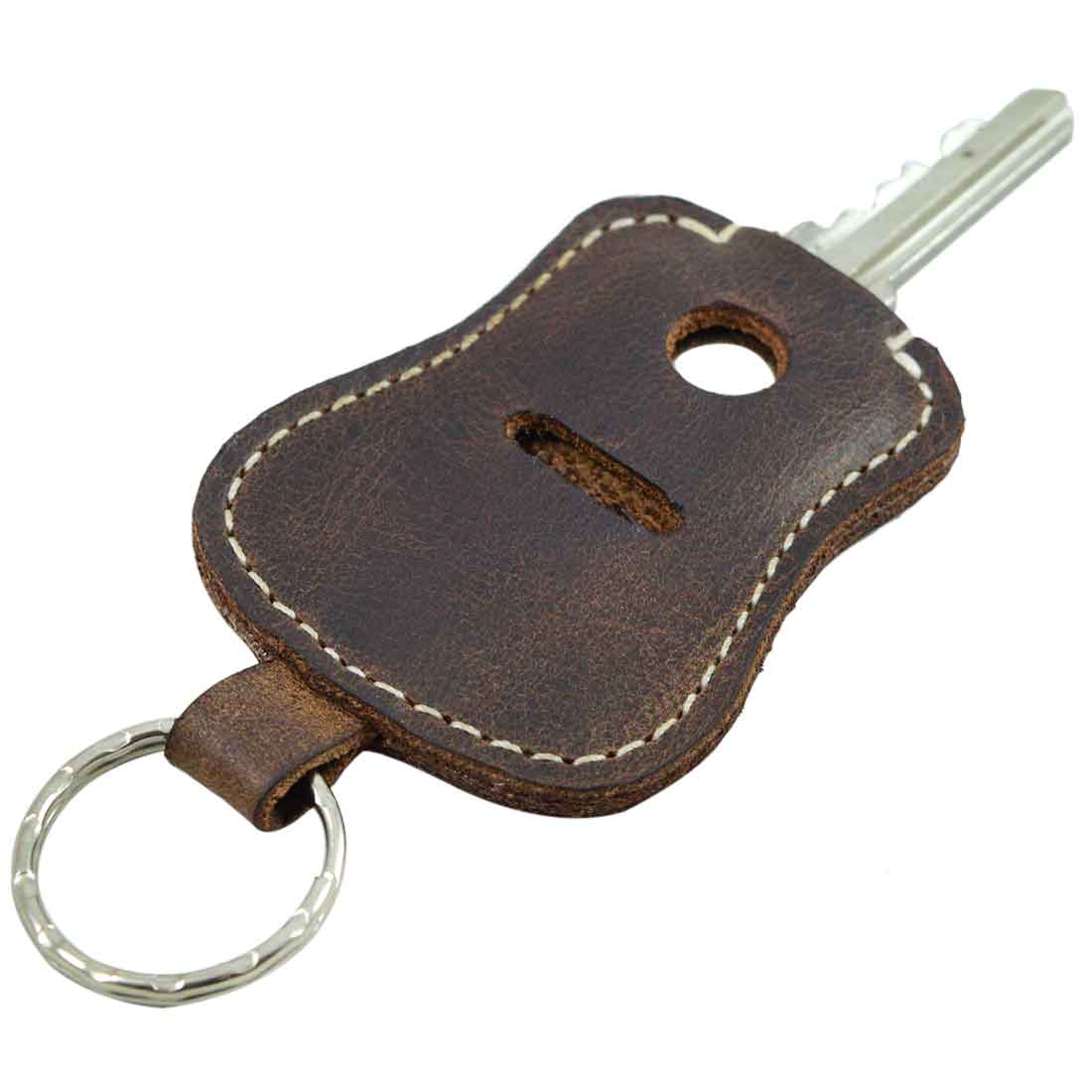The Guitar Keychain by Hide & Drink in a side view, designed to hold your essential keys securely. This keyring is crafted from high-quality Full Grain Leather, hand cut and sewn, reflecting small batch production artistry from La Antigua Guatemala & Oaxaca Mexico.