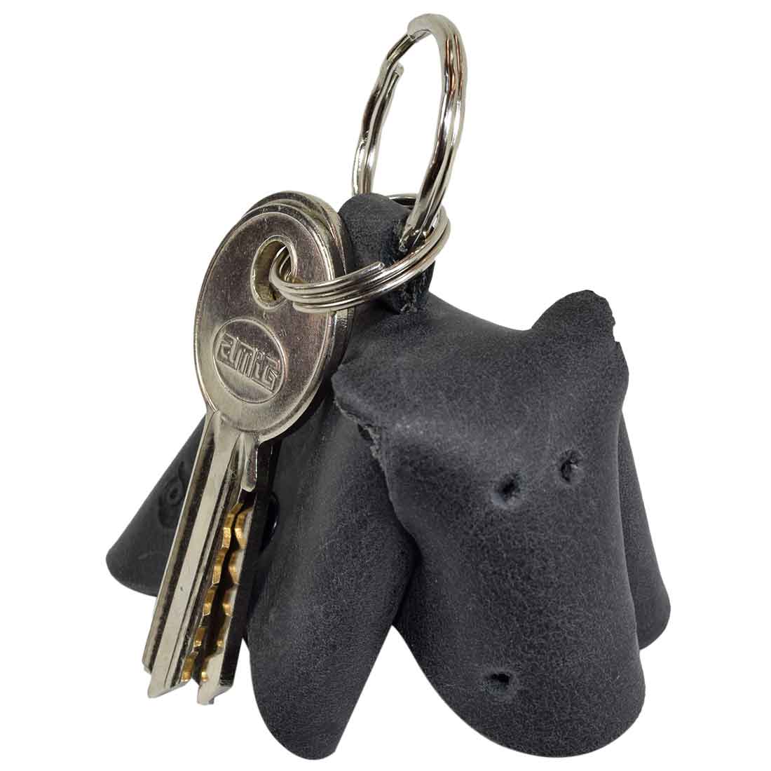 Unique Full Grain Leather Animal Key Chain by Hide & Drink highlighting a cute cow design. This Critter Keychain serves as a chic fob charm and an animal key holder charm pendant, representing high-quality small batch craftsmanship from La Antigua Guatemala.