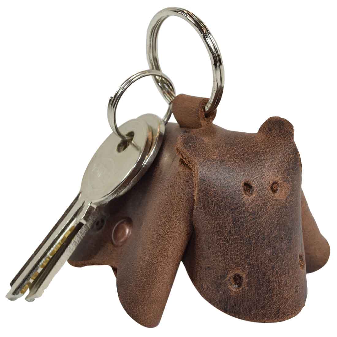 Stylish Full Grain Leather Animal Key Chain by Hide & Drink, highlighting a handcrafted cow design. This unique Critter Keychain acts as a fob charm and an animal key holder charm pendant, produced in small batches by artisans in La Antigua Guatemala.