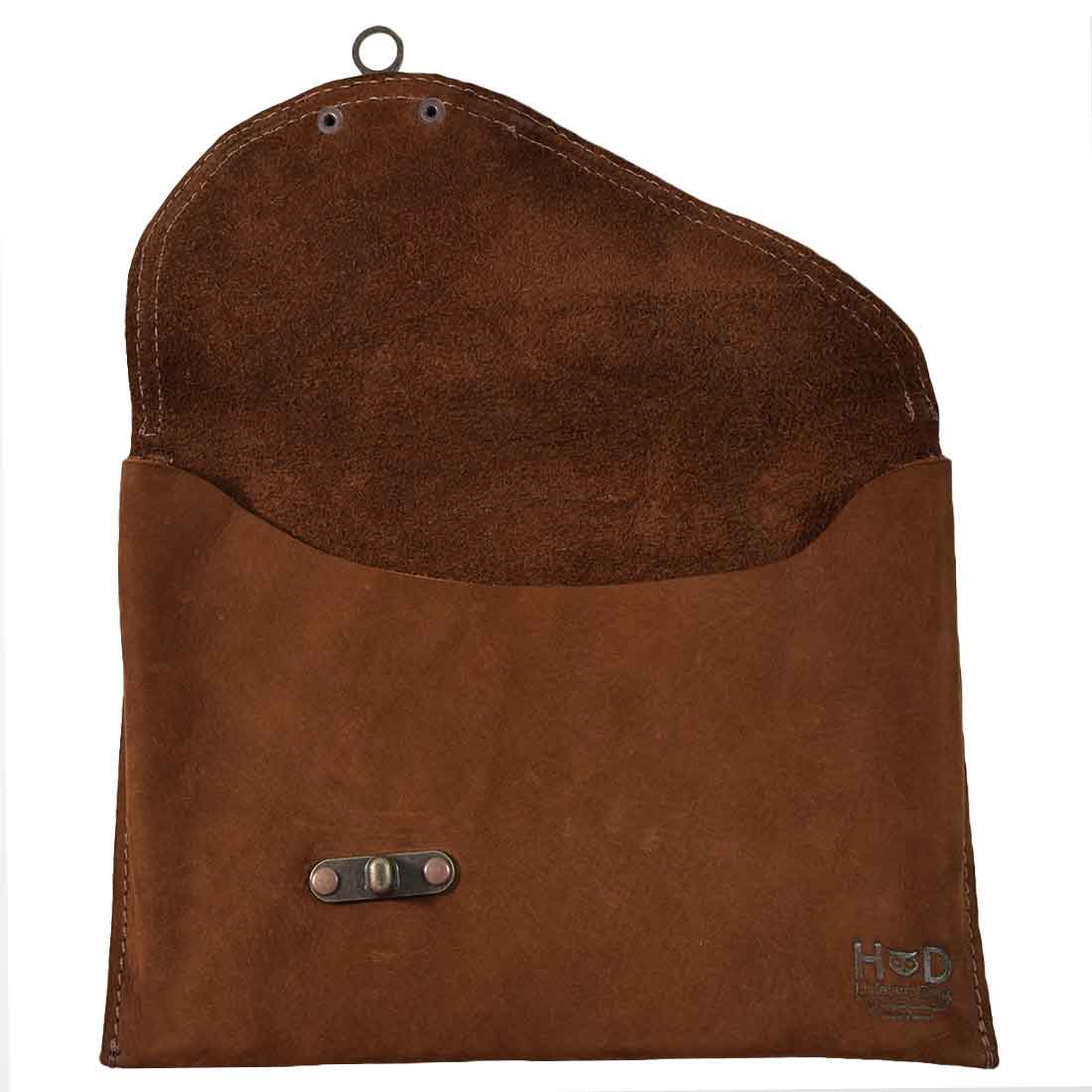 Interior of a brown Vintage Clutch Bag by Hide & Drink, showcasing the Full Grain Leather finish and practical design elements. Handmade in Oaxaca Mexico with artisan attention.