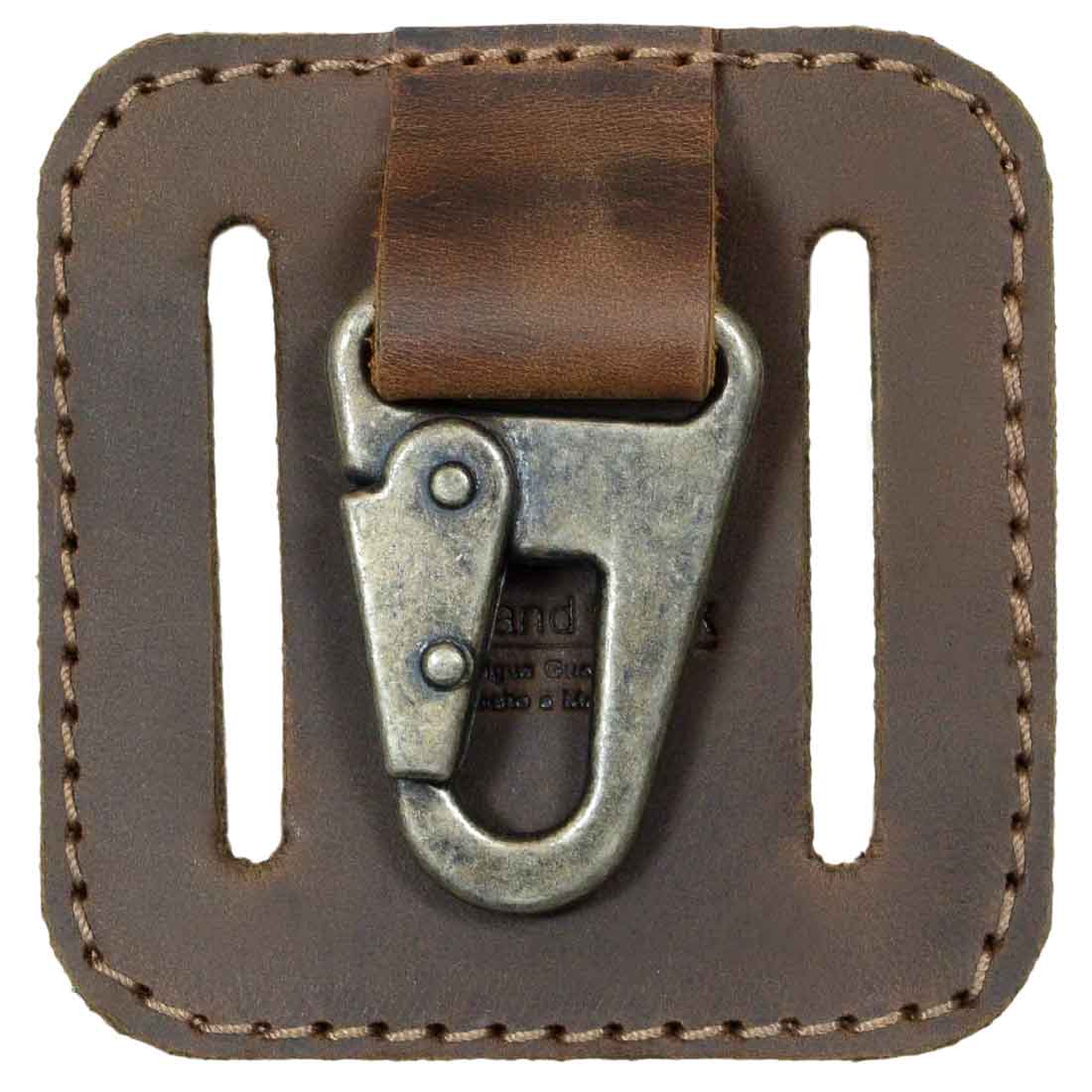 Detailed view of the clasp of the Belt Key Holder by Hide & Drink, featuring a vintage keychain design with rustic charm. This essential accessory is crafted from premium full grain leather, embodying small batch production and handmade artistry from La Antigua Guatemala & Oaxaca Mexico.