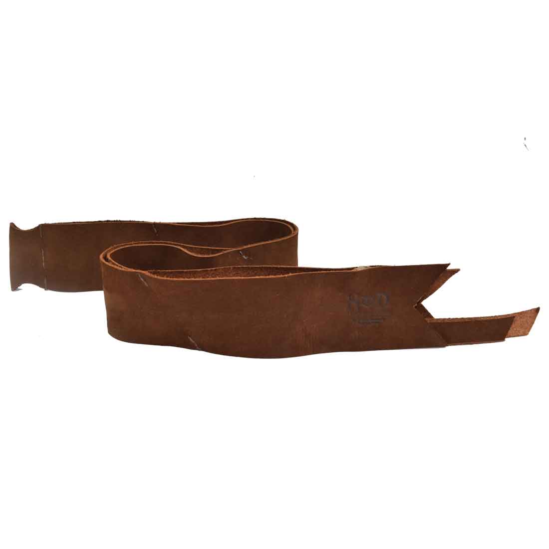 Beautiful Suede Leather Ribbon Decor by Hide & Drink showcasing a handcrafted Bow Wrap for Christmas. A perfect addition for your holiday gifts, this piece is a testament to artisan skills with small batch production and hand cut, hand sewn detailing made in La Antigua Guatemala and Oaxaca Mexico.