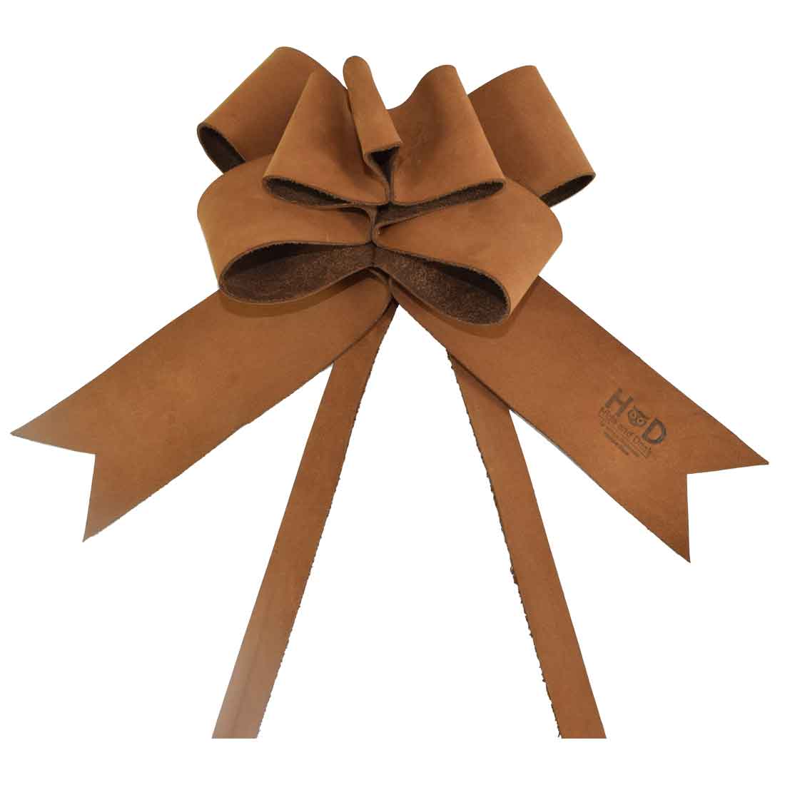 Warm-toned Tan Ribbon Decor by Hide & Drink showing off a beautifully handcrafted Bow Wrap for Christmas. Made from premium Full Grain Leather, this artisan piece embodies the essence of small batch production, hand cut and hand sewn craftsmanship made in La Antigua Guatemala and Oaxaca Mexico.