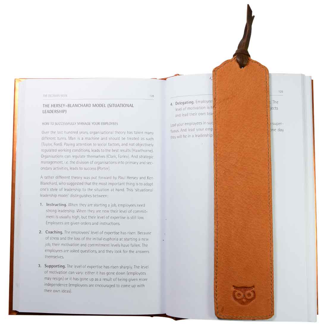 Deluxe Long Bookmark (2 Pack) featuring a light brown leather bookmark with rope, displayed in a book. This charming reversible page marker is a classic accessory for reading lovers, crafted from full grain leather, focusing on stockyardX, small batch production, hand cut, hand sewn, fire branded, artisan quality, handmade in La Antigua Guatemala & Oaxaca Mexico.