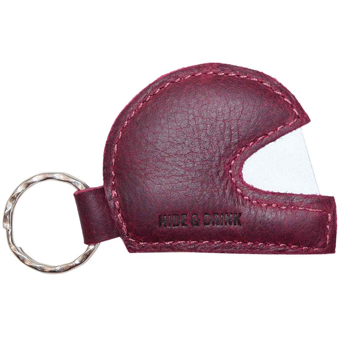 Close-up view of Hide & Drink's Motorcycle Helmet Keychain showing the intricate craftsmanship. This helmet leather keychain, made from full grain leather, is a must-have for bikers and racing enthusiasts, emphasizing artisan quality and handmade charm.