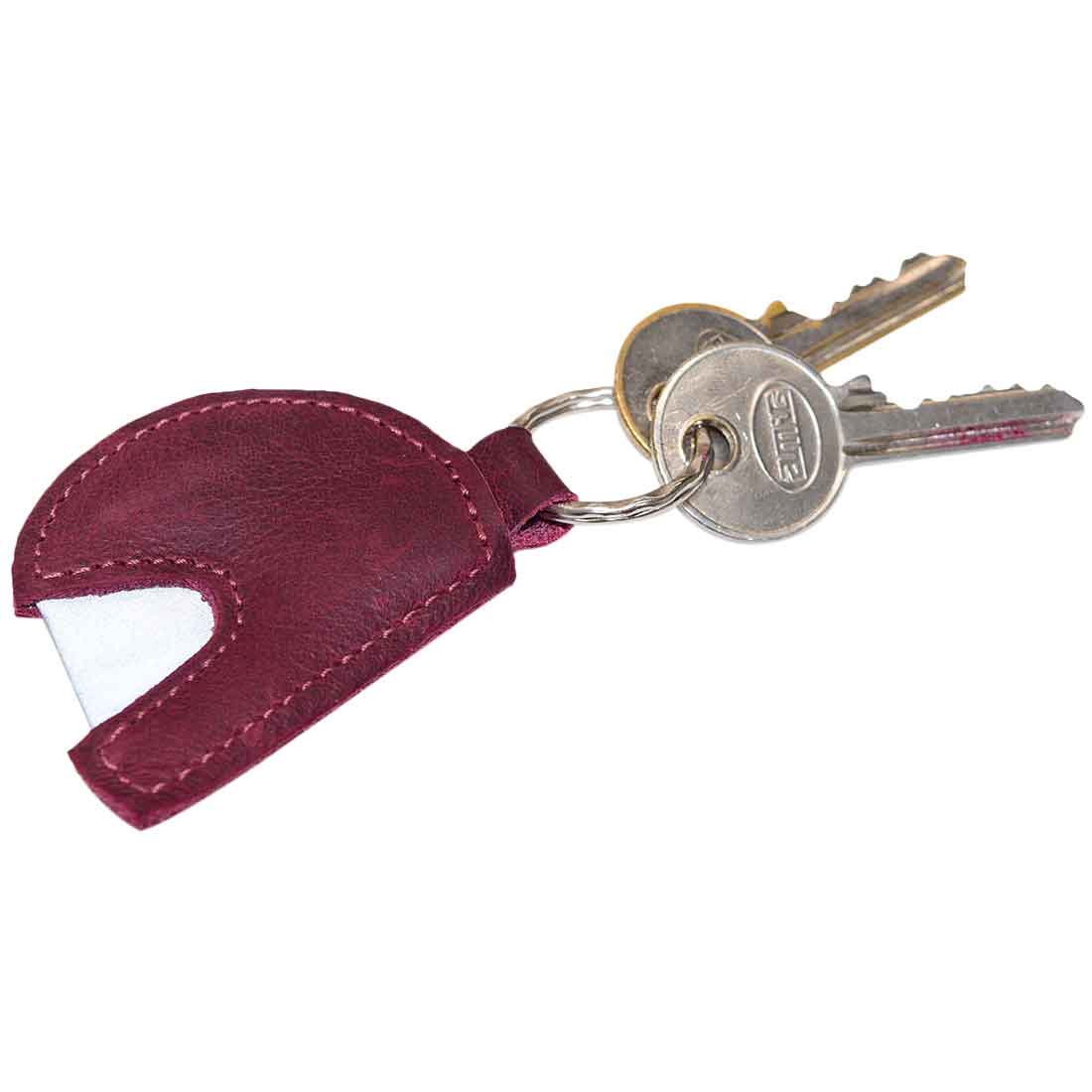 Hide & Drink Motorcycle Helmet Keychain attached to keys, showcasing its practical use as a key holder. This durable leather accessory is handcrafted with love in La Antigua Guatemala, ideal for motorcycle lovers and stylish enough for daily use.