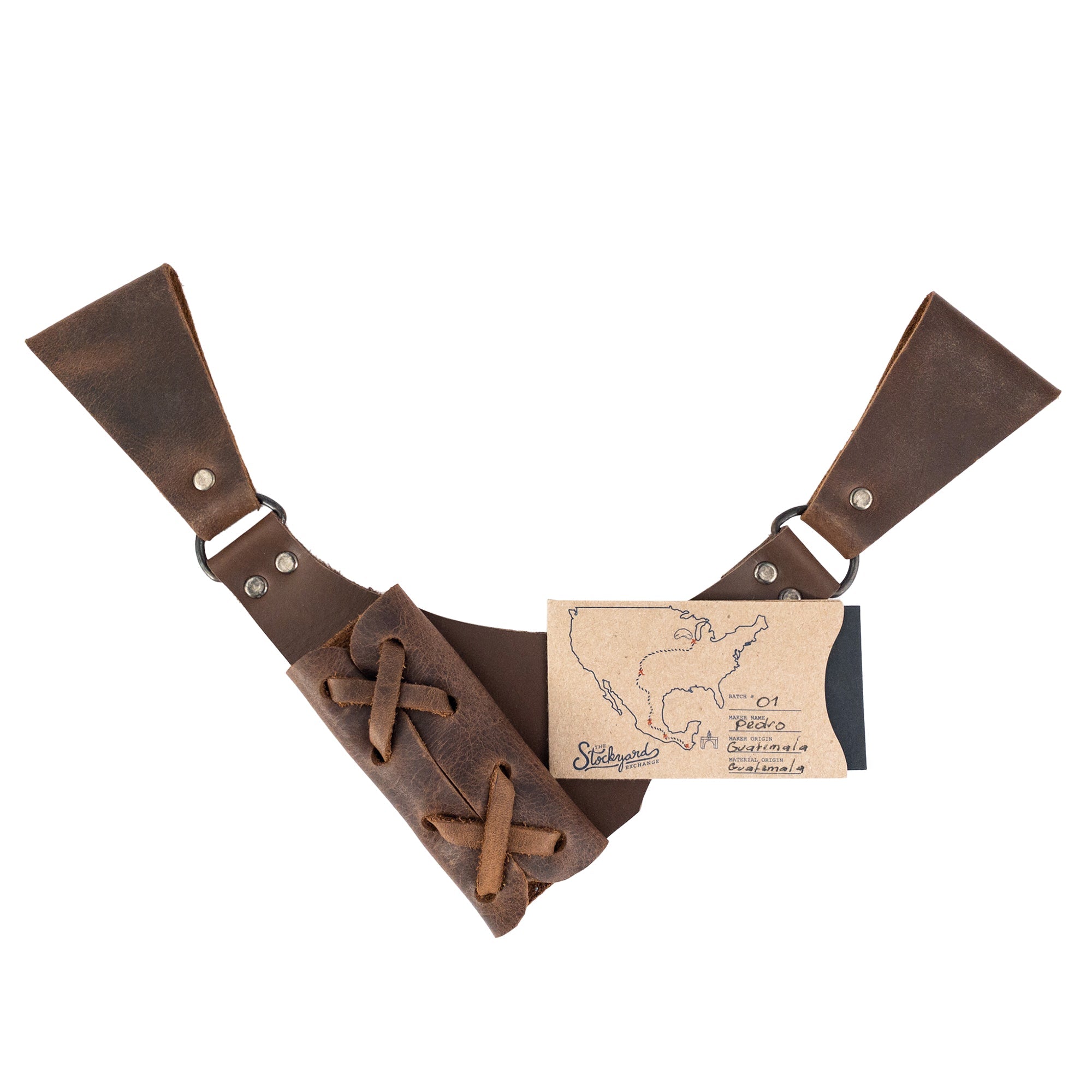 The Dangling Sword Holder by Hide & Play presented alongside a care tag, emphasizing its artisan quality. This full grain leather accessory is crafted for fantasy cosplay and historical costumes, highlighting small batch production handmade in La Antigua Guatemala and Oaxaca Mexico.
