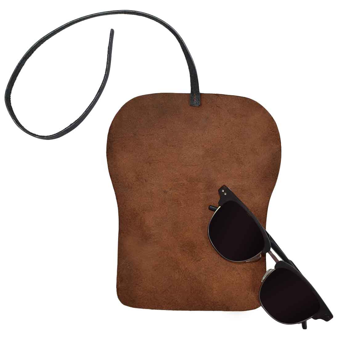 Hide & Drink Leather Sunglass Wrap comes with a stylish leather cord to secure your sunglasses. Crafted from full grain leather, it serves as an eye glasses storage solution, perfect for travel. This artisan-made product is hand cut and sewn, ensuring quality and durability.