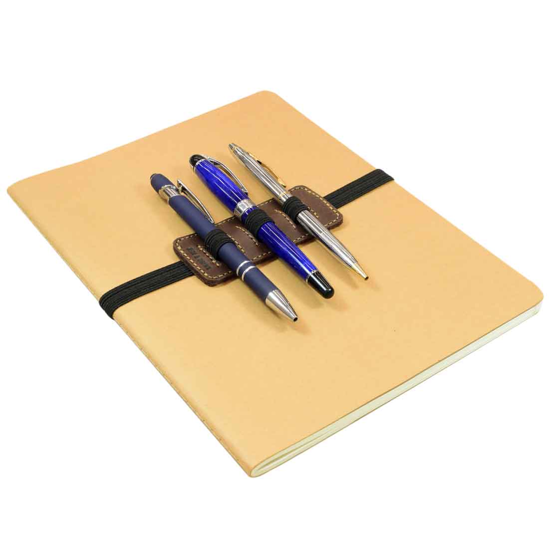 The Pen Holder W/Adjustable Band by Hide & Drink, neatly attached to a notebook with pens in place, exemplifying its use in Home & Office Essentials. Crafted from Full Grain Leather, this item highlights artisan skills from La Antigua Guatemala.