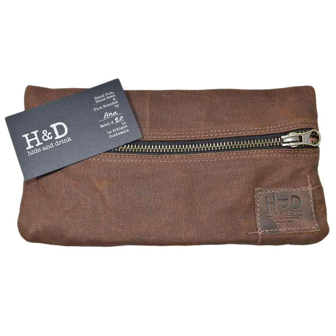 The branding detail on this brown Hide & Drink Vape Pen Case (Accessories not included) underlines its artisanal value. A classic Pen Accessories Kit Pouch Holder built for secure fit. G Pen Soft Travel Bag Handmade from Waxed Canvas, Full Grain Leather, StockyardX, Small Batch Production, Hand Cut, Hand Sewn, Fire Branded, Artisan, Handmade in La Antigua Guatemala & Oaxaca Mexico.