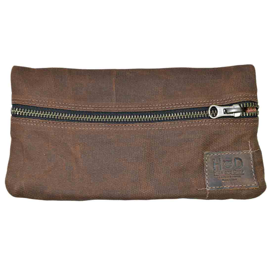 A sleek view of the brown Hide & Drink Vape Pen Case (Accessories not included) showcasing its practicality for daily use. Ideal as a Pen Accessories Kit Pouch Holder ensuring secure fit. G Pen Soft Travel Bag Handmade from Waxed Canvas, Full Grain Leather, StockyardX, Small Batch Production, Hand Cut, Hand Sewn, Fire Branded, Artisan, Handmade in La Antigua Guatemala & Oaxaca Mexico.