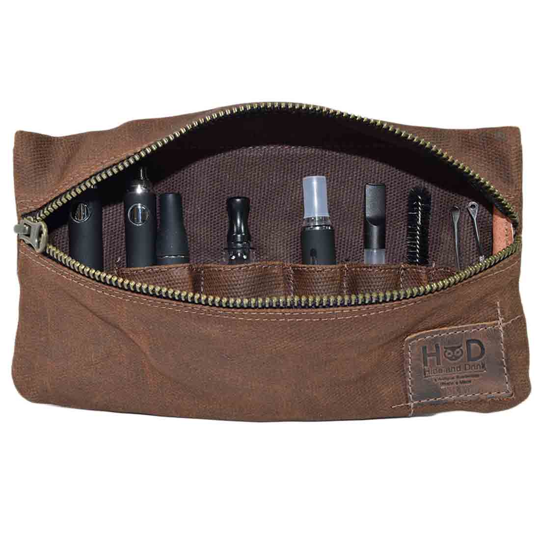 The brown Hide & Drink Vape Pen Case (Accessories not included) with various pockets for optimal organization. A trusted Pen Accessories Kit Pouch Holder designed for secure fit. G Pen Soft Travel Bag Handmade from Waxed Canvas, Full Grain Leather, StockyardX, Small Batch Production, Hand Cut, Hand Sewn, Fire Branded, Artisan, Handmade in La Antigua Guatemala & Oaxaca Mexico.