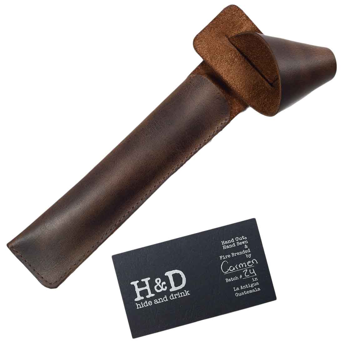 Hide & Drink Vape Pen Holder accompanied by brand card, showcasing the details of this exquisite Pen Holder for Handbags. This Hanging Pen Case for Tote Bag is made from full grain leather, emphasizing craftsmanship that comes from small batch production, with features that are hand cut, hand sewn, and fire branded by artisans in La Antigua Guatemala & Oaxaca Mexico.