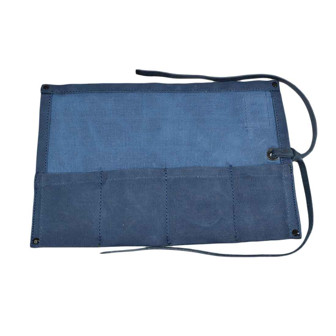 The back view of the blue Waxed Canvas Watch Roll from Hide & Drink, demonstrating its capacity to hold up to 4 watches. This piece is handcrafted for watch enthusiasts.