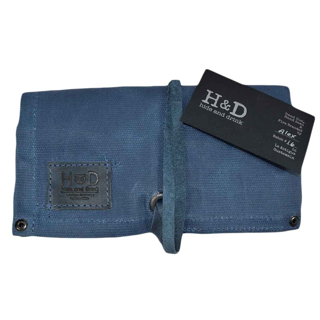 Featuring another angle of the blue Waxed Canvas Watch Roll by Hide & Drink, showing its elegant design and handcrafted quality. Holds up to 4 watches securely.