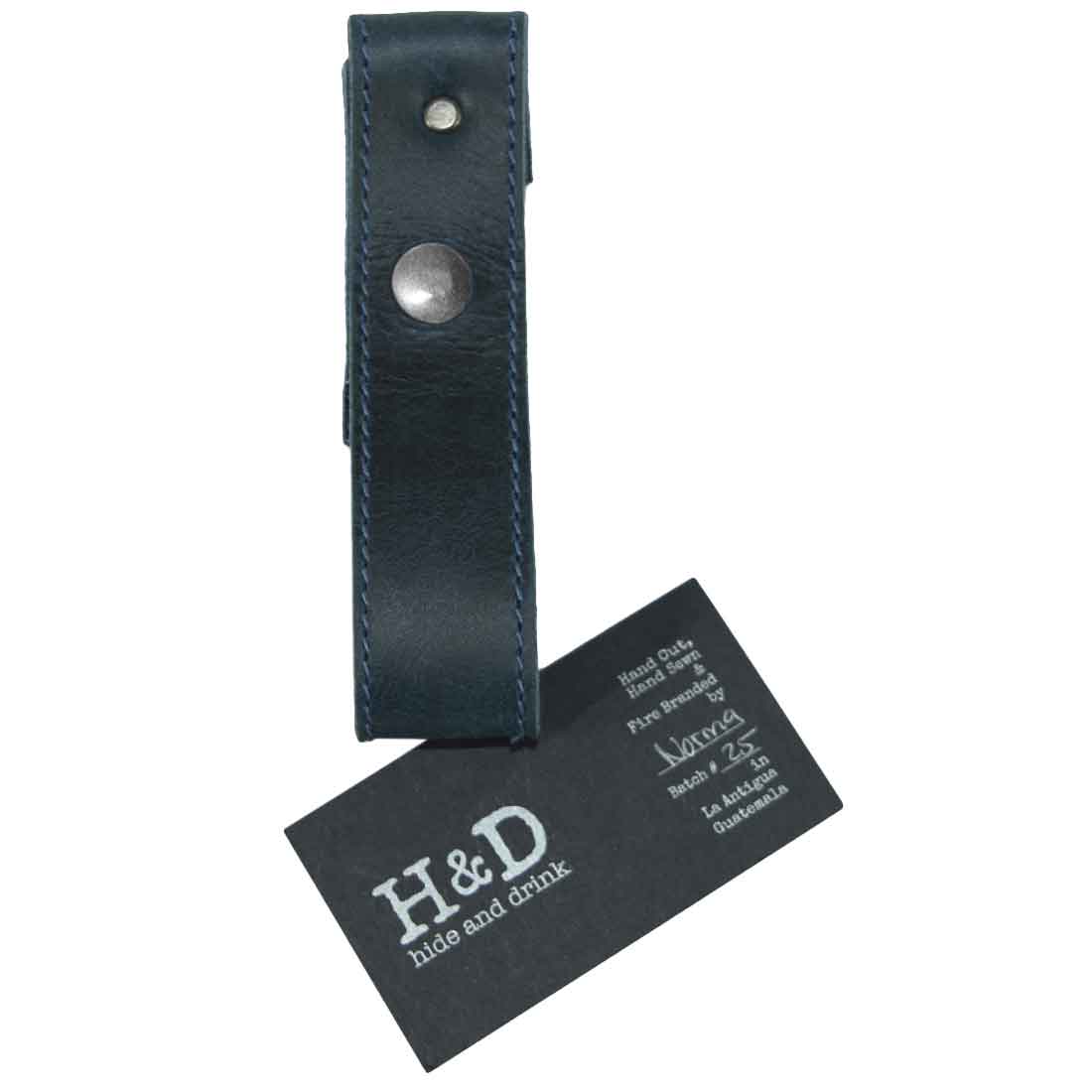 Hide & Drink Whip Holster with dimensions showcased to highlight its handmade quality. This elegant accessory is crafted from Full Grain Leather, serving as a durable Bullwhip Holder while emphasizing the artisan, Handmade process typical of Small Batch Production from La Antigua Guatemala & Oaxaca Mexico.