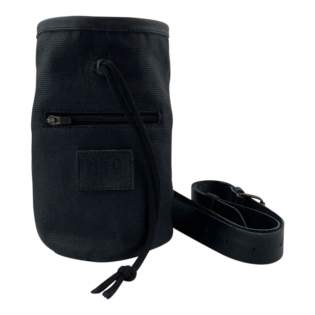 Hide & Drink Chalk Bag in classic black, featuring durable Waxed Canvas and a zippered pocket. Ideal for rock climbing and gymnastics, this handmade bag is crafted from Full Grain Leather by artisans in La Antigua Guatemala & Oaxaca Mexico.