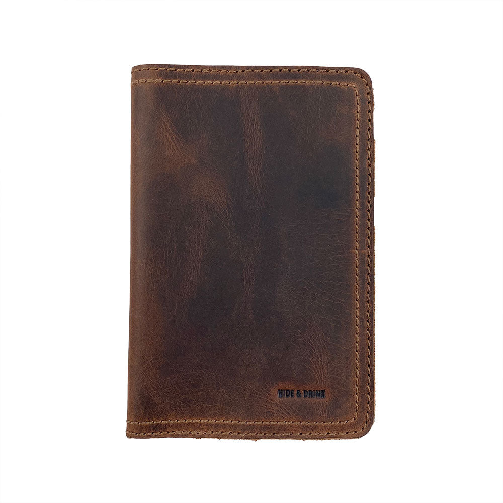 An engaging top view of the Hard Cover Notebook Protector (Notebook NOT Included) by Hide & Drink, focusing on its stylish design. This journal cover suits Moleskine Hard Cover Sketchbook XXL Size (8.5 x 11 in.), Notebook NOT Included, crafted using premium Full Grain Leather, reflecting StockyardX’s small batch production ethos with hand cut, hand sewn, and fire branded artisan skill. Handmade in La Antigua Guatemala & Oaxaca Mexico.