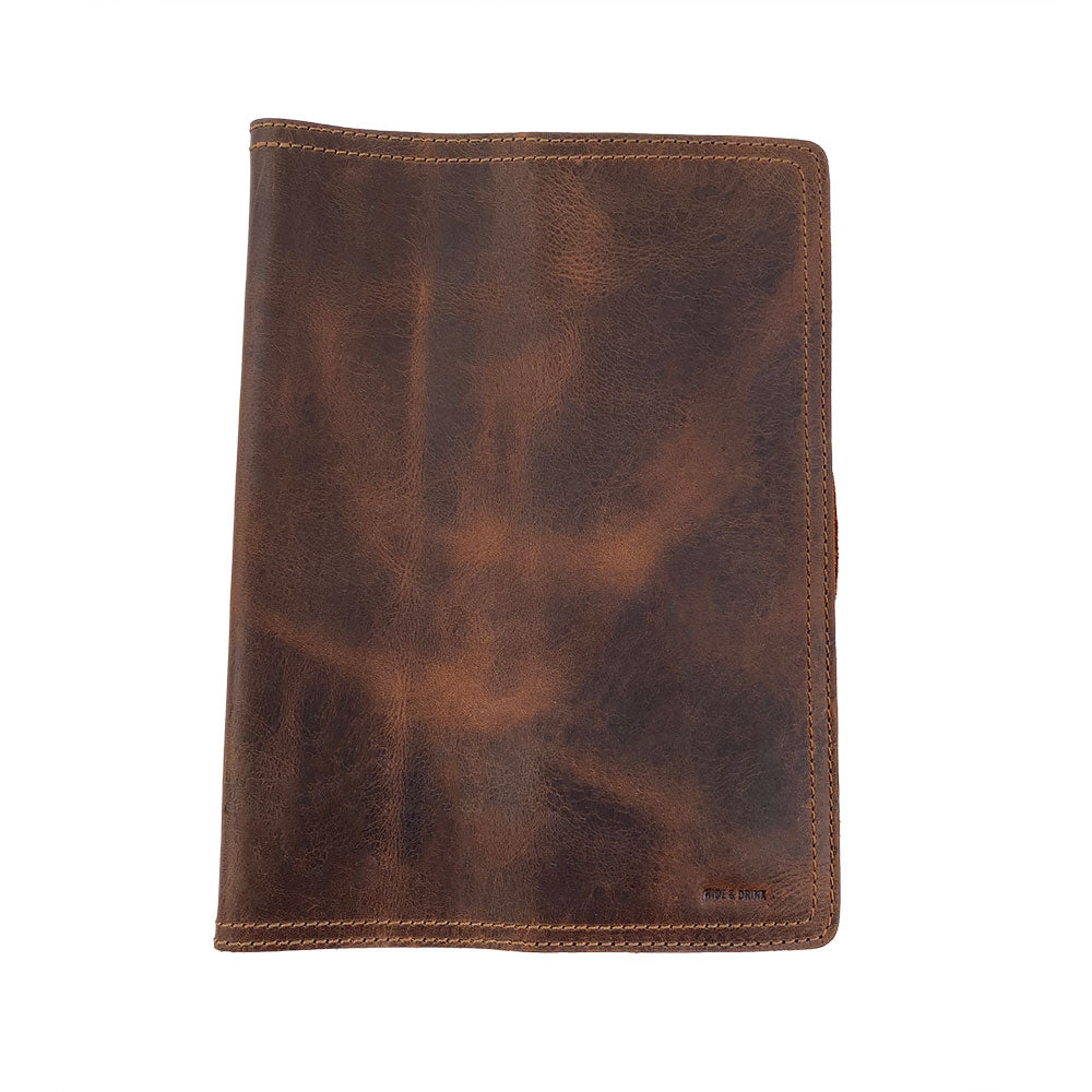 An exceptional side view of the Hard Cover Notebook Protector (Notebook NOT Included) by Hide & Drink, showcasing the leather quality. This journal cover suits Moleskine Hard Cover Sketchbook XXL Size (8.5 x 11 in.), Notebook NOT Included, crafted from robust Full Grain Leather, exemplifying StockyardX’s small batch production with careful hand cut, hand sewn, and fire branded techniques by artisans. Handmade in La Antigua Guatemala & Oaxaca Mexico.
