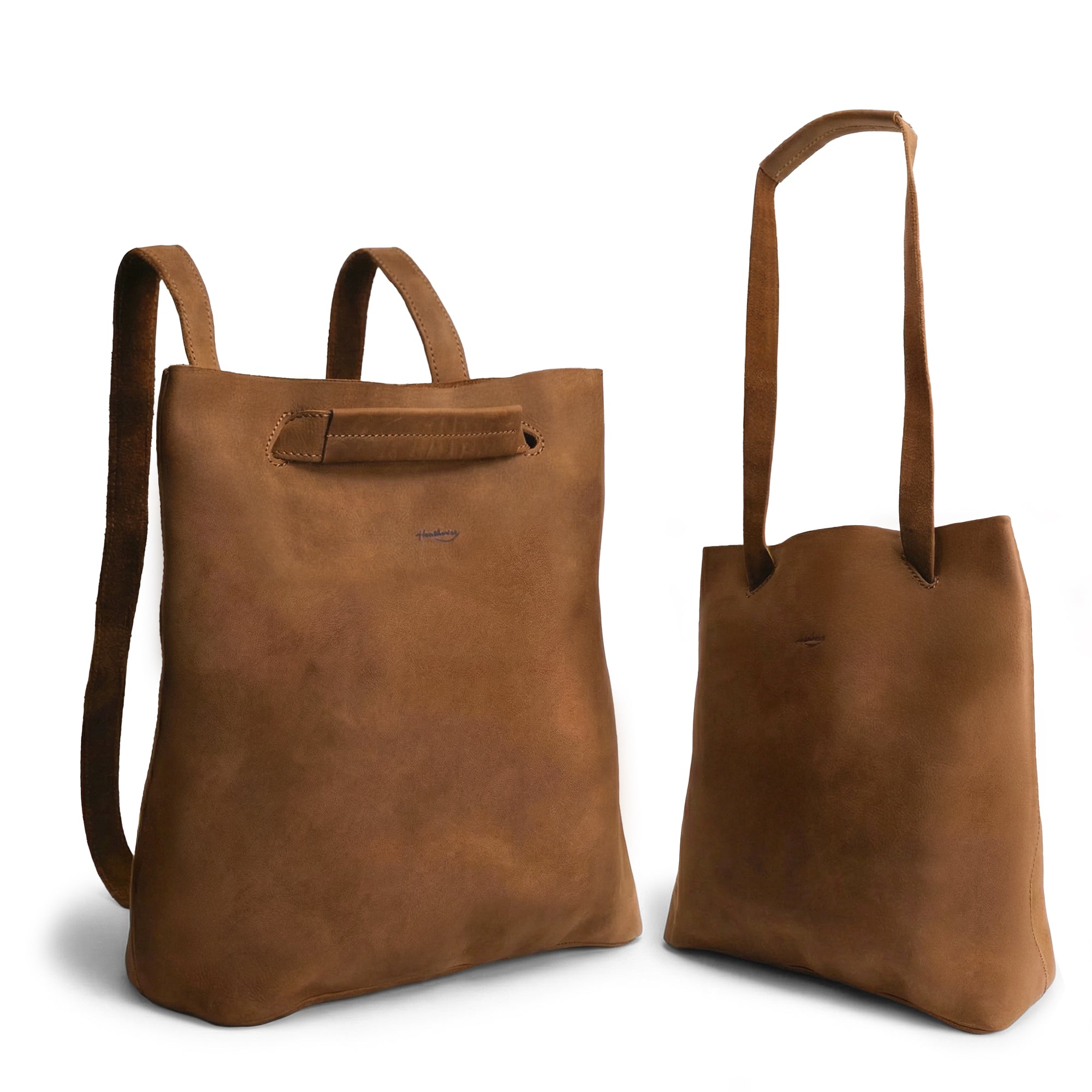 A stylish Convertible Backpack to Shoulder Bag by Heather's, showcasing its versatile design. This squared purse is made from high-quality Full Grain Leather, perfect for women seeking a spacious crossbody. Hand crafted through small batch production, this bag features hand cut, hand sewn, and fire branded details, reflecting the artisan craftsmanship from La Antigua Guatemala & Oaxaca Mexico.