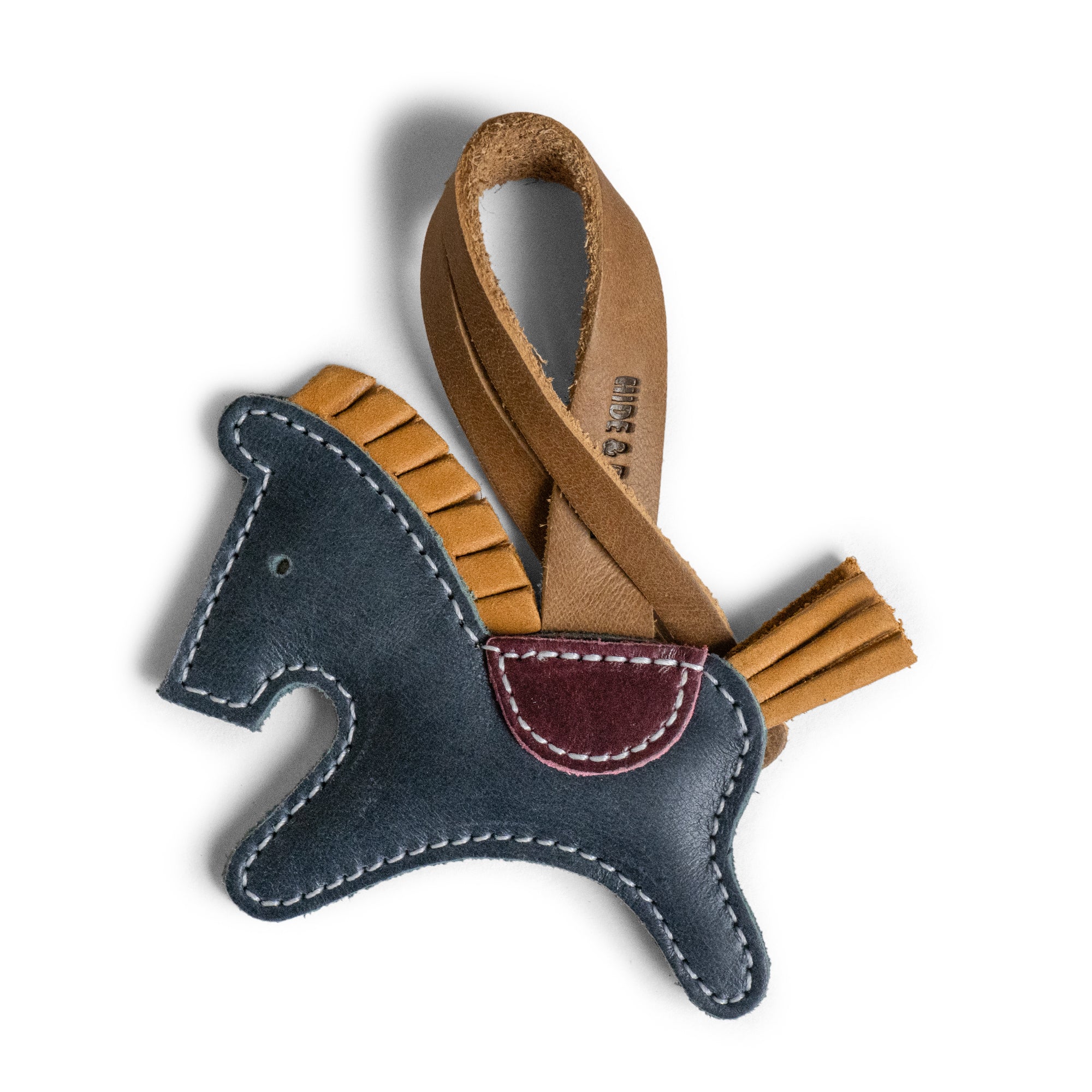 Hide & Drink Horse Bag Charm crafted from full grain leather, a unique ornament for handbags and purses. This artisan handmade charm from La Antigua Guatemala adds a stylish touch. Perfect for women, it’s a fire branded, hand cut, and hand sewn accessory that enhances tote bags and backpacks.