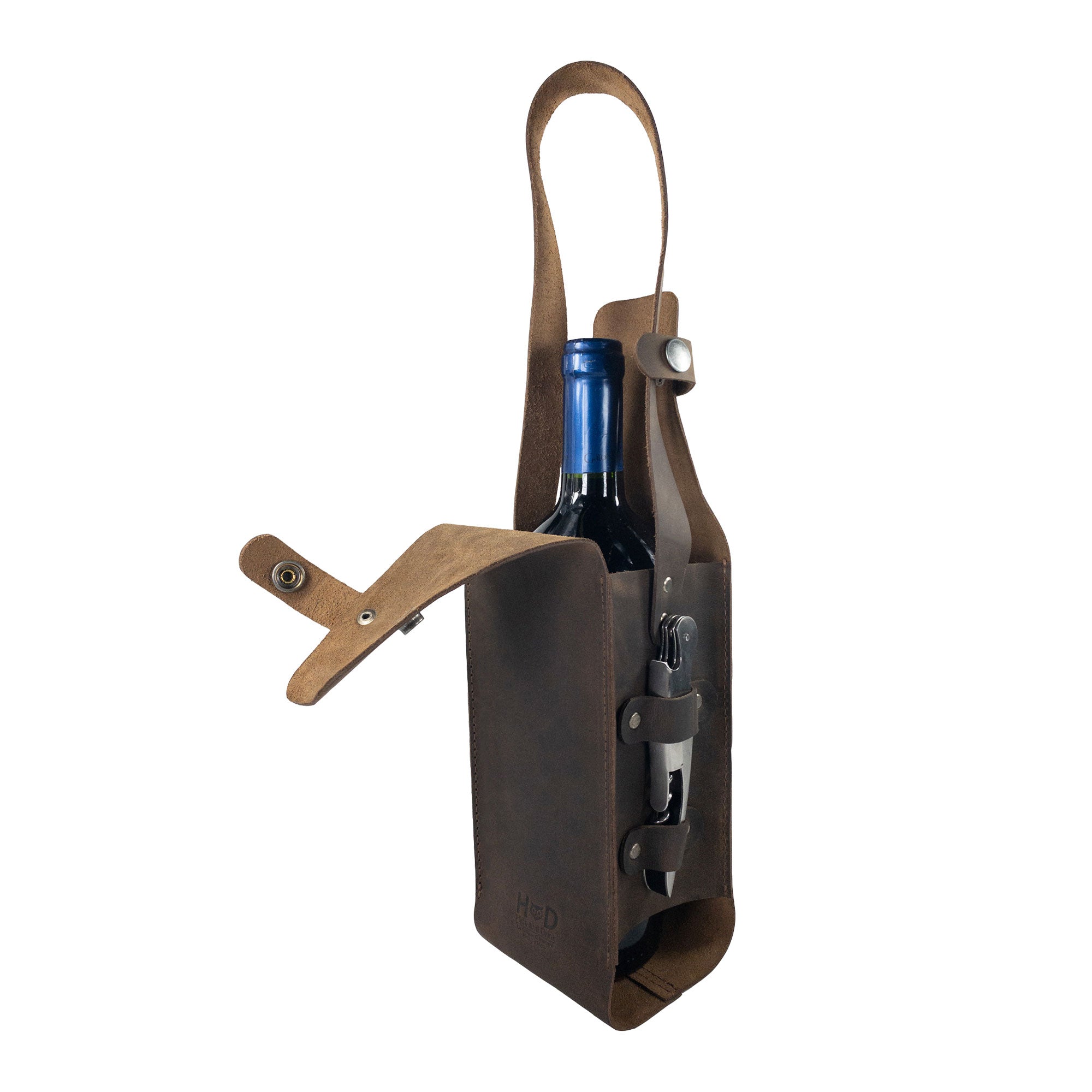 Hide & Drink's Single Bottle Wine Carrier in Full Grain Leather, showcasing a rustic design perfect for wine lovers. This Single Bottle Wine Carrier features riveted closures, embodying the essence of Small Batch Production, Hand Cut, Hand Sewn, and Fire Branded craftsmanship by artisans from La Antigua Guatemala & Oaxaca Mexico.