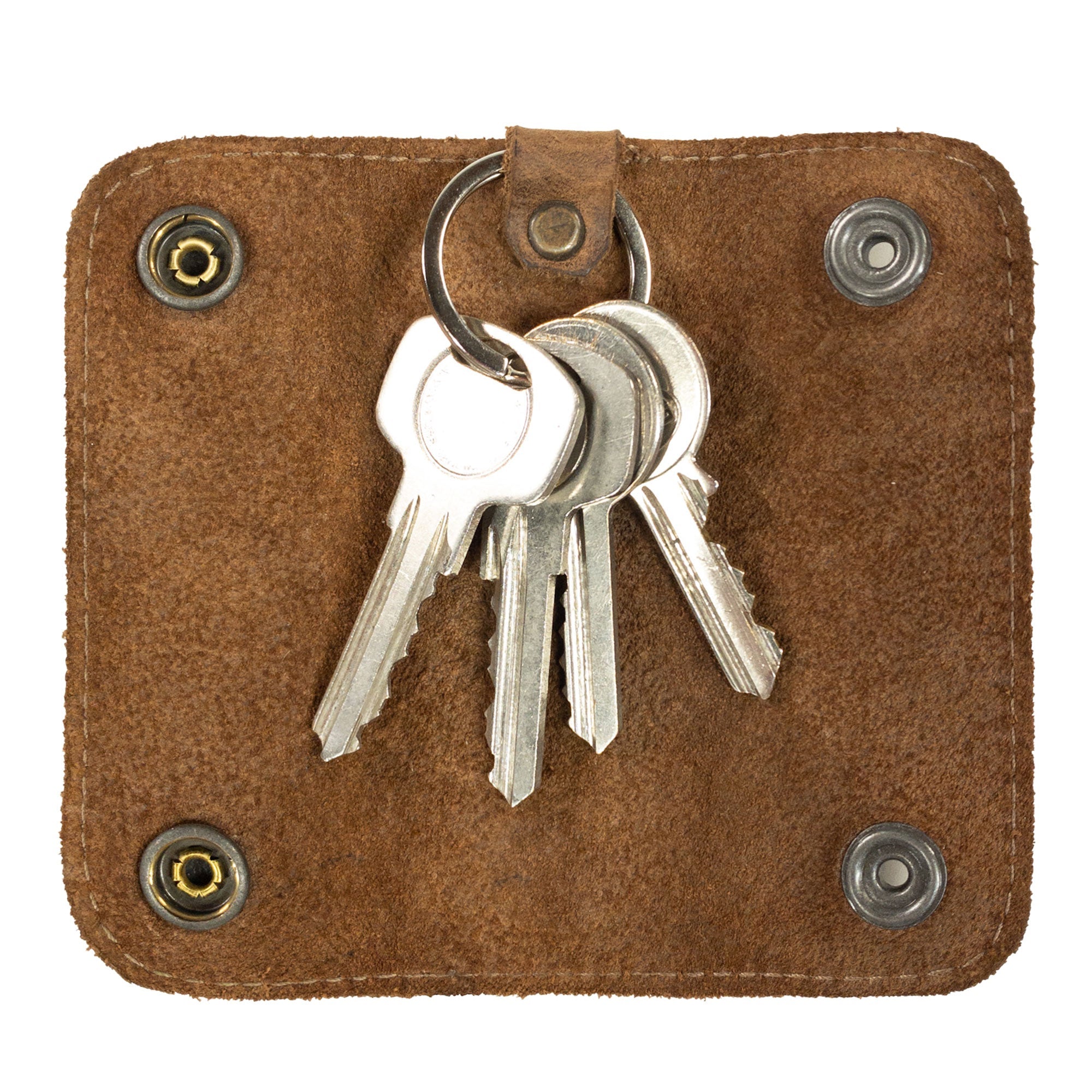 The Double Snap Key Holder by Hide & Drink features a rustic design showcasing keys securely held in place, made from premium Full Grain Leather. An ideal Key Ring Organizer, this handmade accessory reflects small batch production quality, hand cut and hand sewn by artisans in La Antigua Guatemala & Oaxaca Mexico.