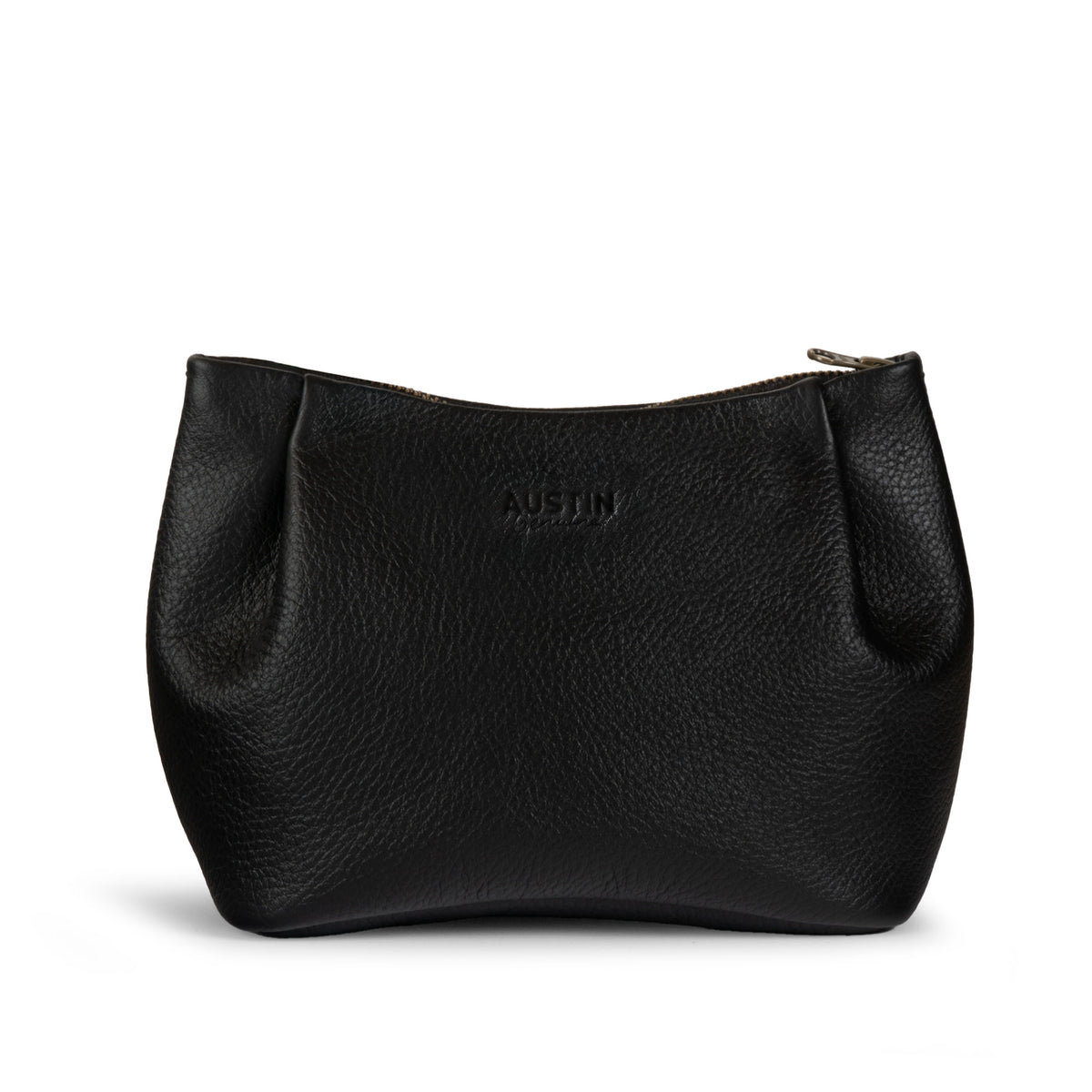 Austin Genuine The Kinney Beauty Bag, a black The Kinney Beauty Bag Full Grain Leather pouch with a curved silhouette and zip closure, featuring StockyardX, Small Batch Production, Hand Cut, Hand Sewn, Fire Branded, Artisan, Handmade in La Antigua Guatemala & Oaxaca Mexico craftsmanship.