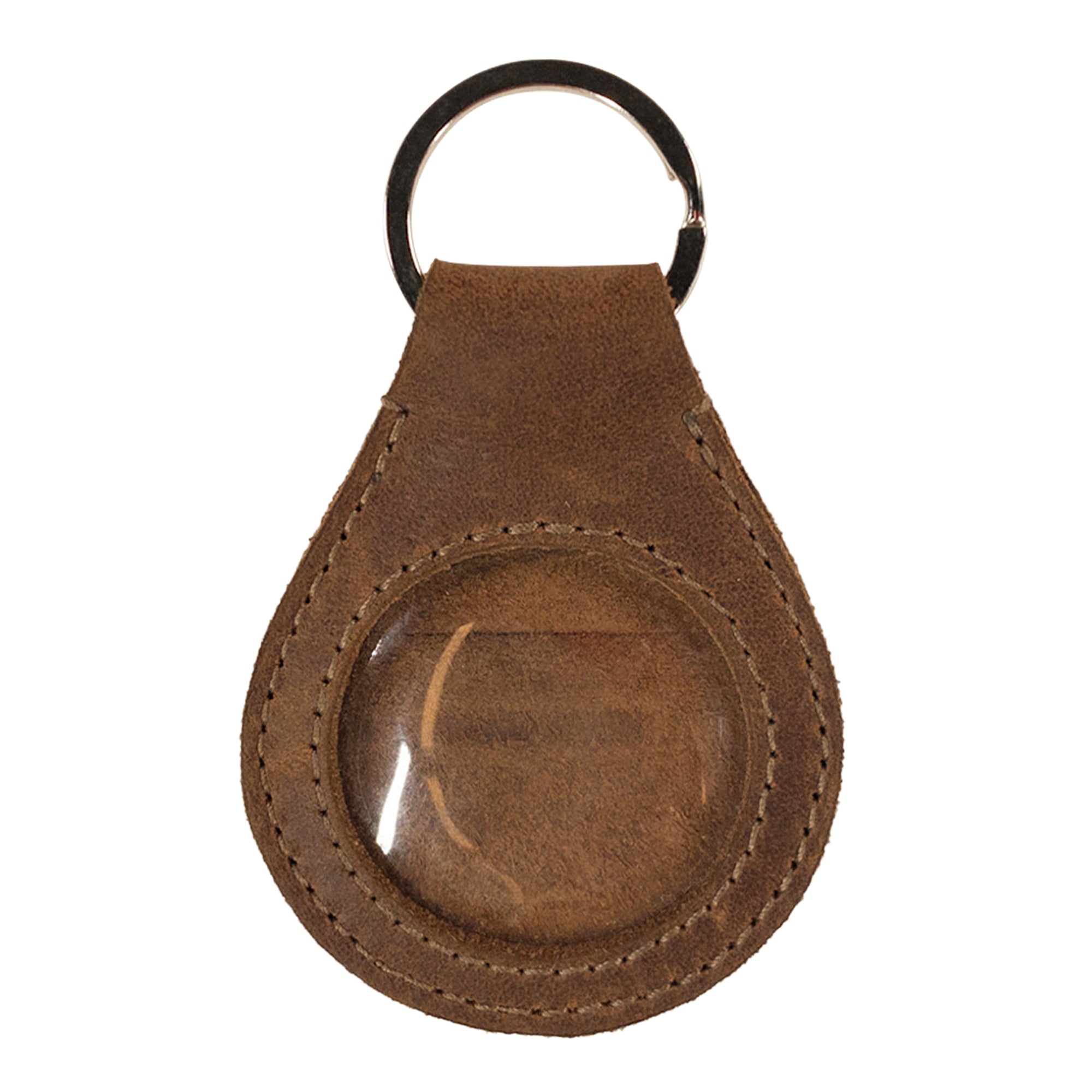 Close-up view of the Medallion Holder Keychain by Hide & Drink featuring a secure keyring attachment designed for storing memorabilia, keepsakes, and special coins. This handmade accessory is crafted from full grain leather, showcasing the artisan quality from small batch production in La Antigua Guatemala & Oaxaca Mexico.