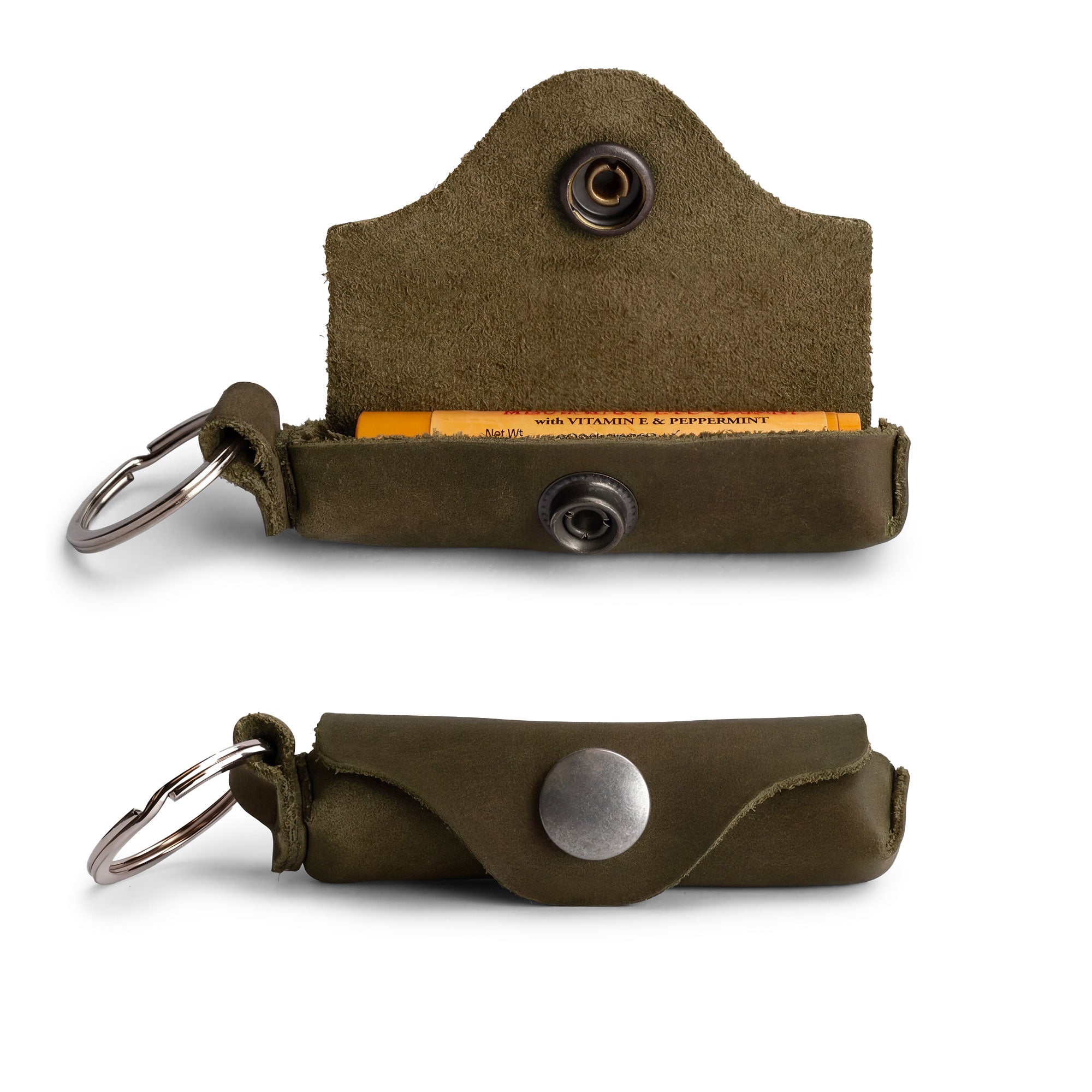 Handcrafted Lip Balm Key Chain from Hide & Drink securely holding a lip balm with keys attached. This classic vintage design features a brass metal clasp and is made of full grain leather, offering excellent lip protection. Perfect for carrying around, this Lip Balm Key Chain is a great accessory for anyone who values artisan craftsmanship, handmade in La Antigua Guatemala & Oaxaca Mexico.