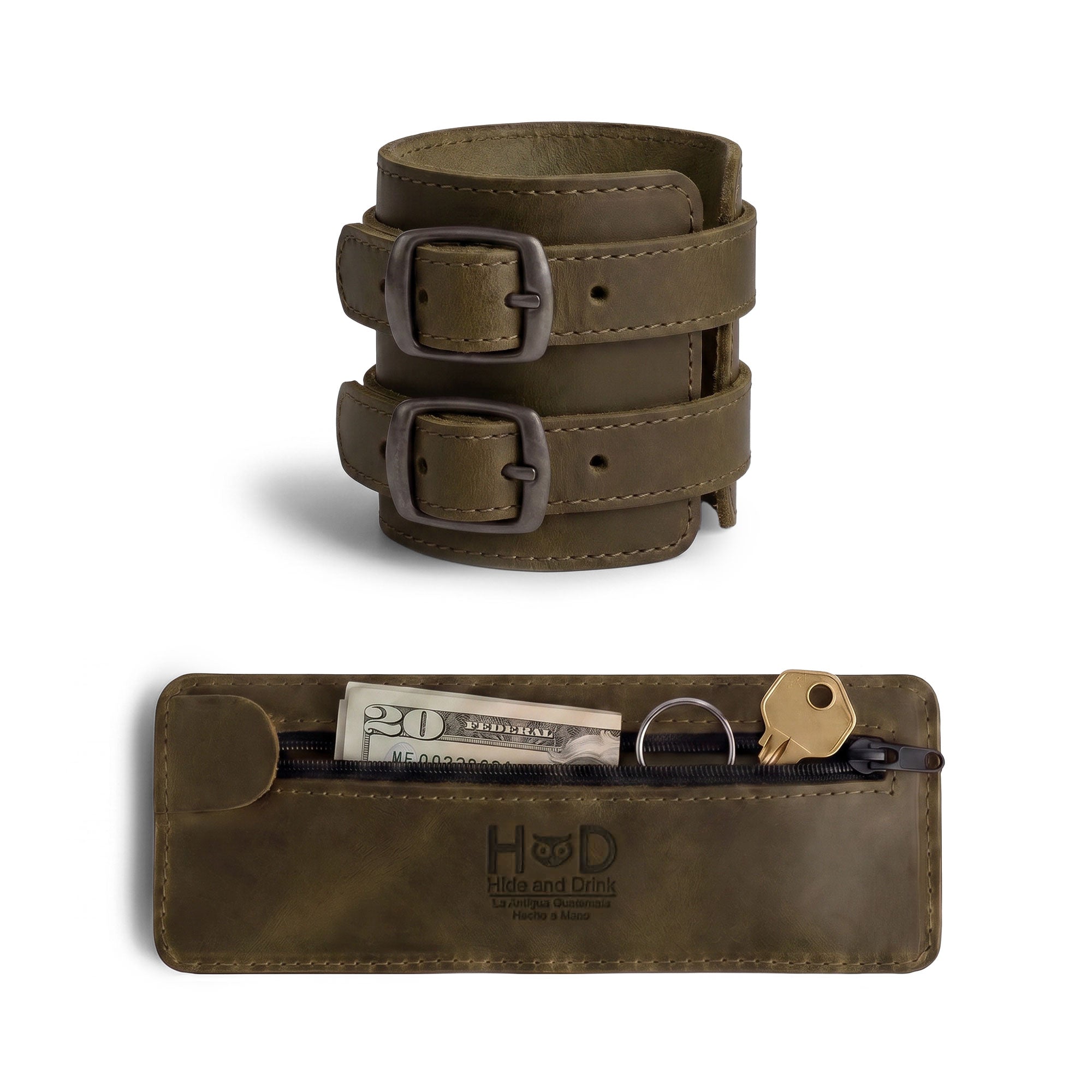 An appealing close-up of Hide & Drink's Wrist-Wallet-Cuff reveals its rustic leather charm, crafted from Full Grain Leather. This stylish bracelet includes a hidden pouch for bills and an inner zippered pouch, catering to modern functionality. Each item is artisanship made in La Antigua Guatemala & Oaxaca Mexico, celebrating quality.