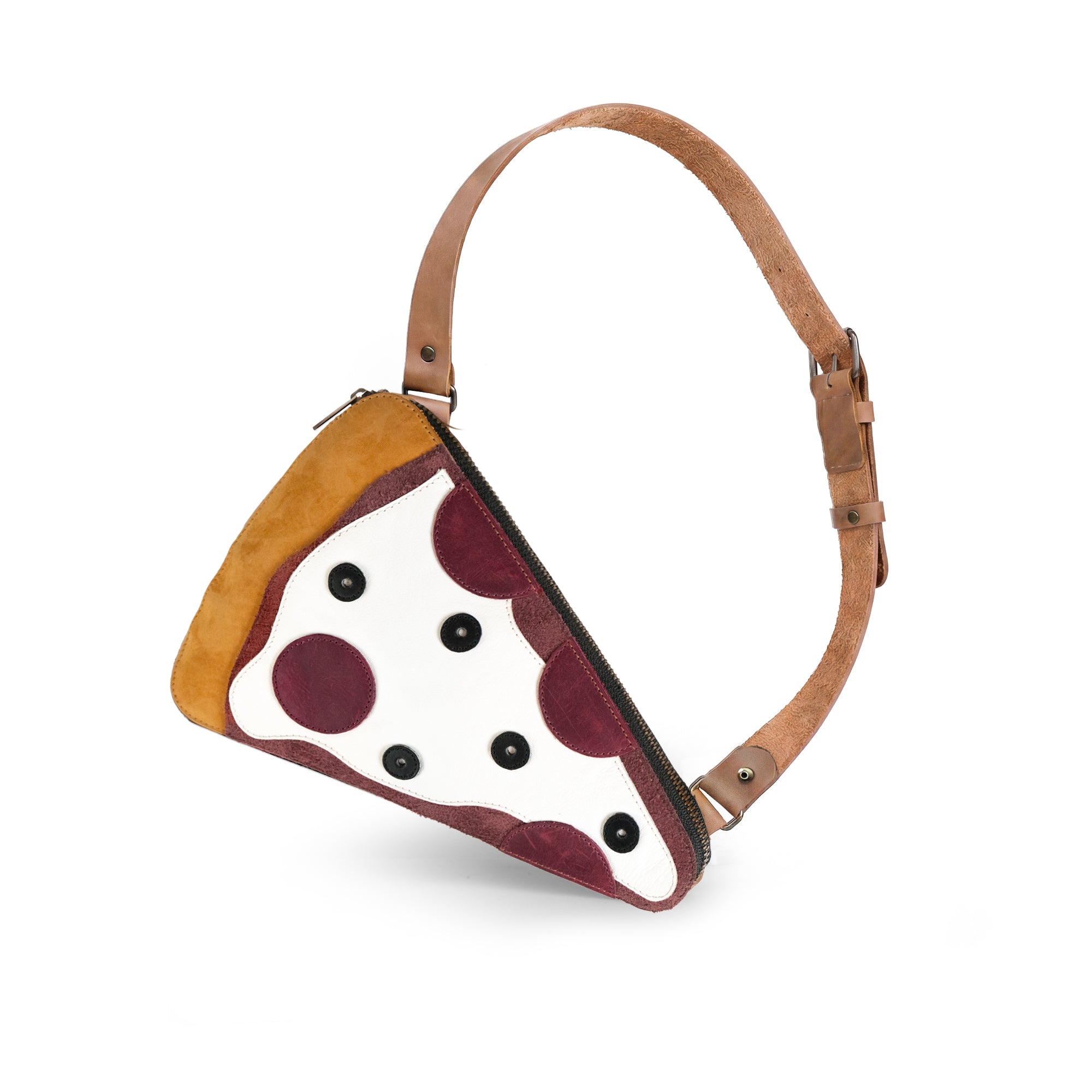 Stylish Pizza Slice-Shaped Shoulder Bag by Tudi Frudi made of Full Grain Leather, featuring a fun pizza slice design. This unique crossbody and messenger bag showcases small batch production, is hand cut and hand sewn, and proudly fire branded by artisans in La Antigua Guatemala.