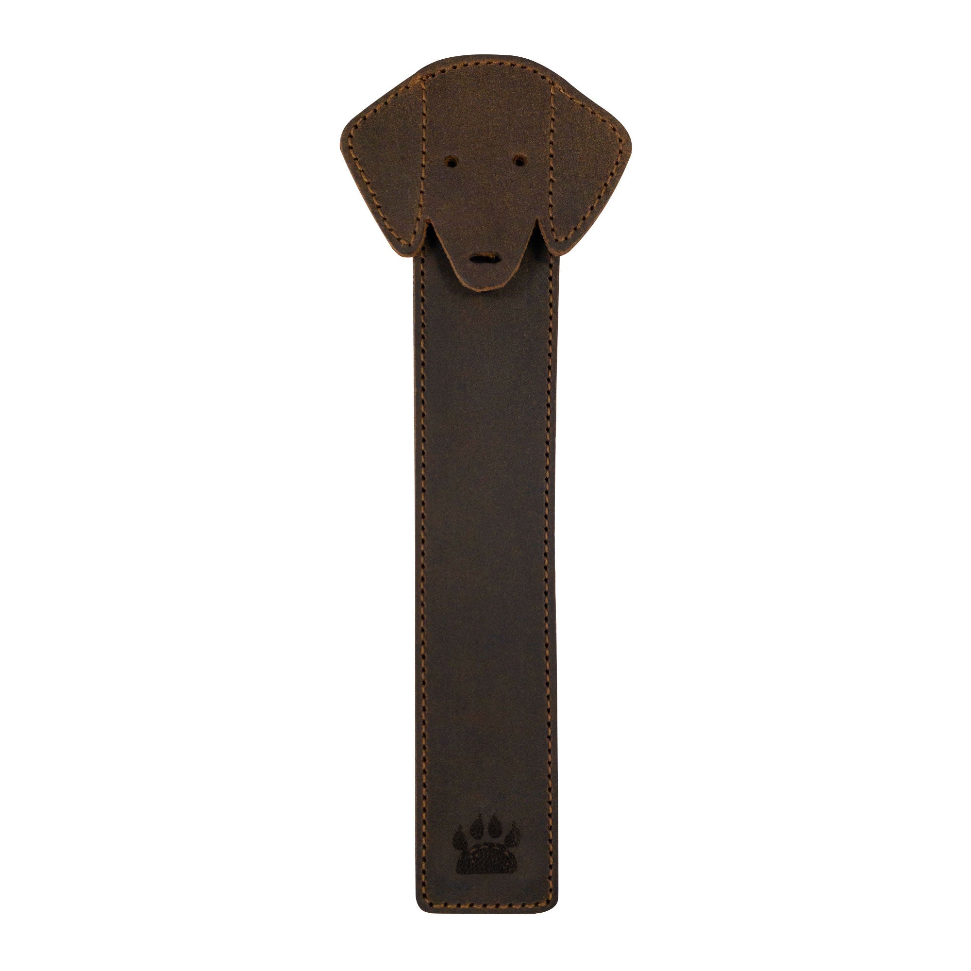 Taco Dog Dog Bookmark featuring a cute dog head design made from full grain leather, perfect for marking pages in any book. This rustic colored, soft and durable bookmark makes a great gift for book and dog lovers, showcasing artisan craftsmanship with small batch production, hand cut and hand sewn in La Antigua Guatemala.