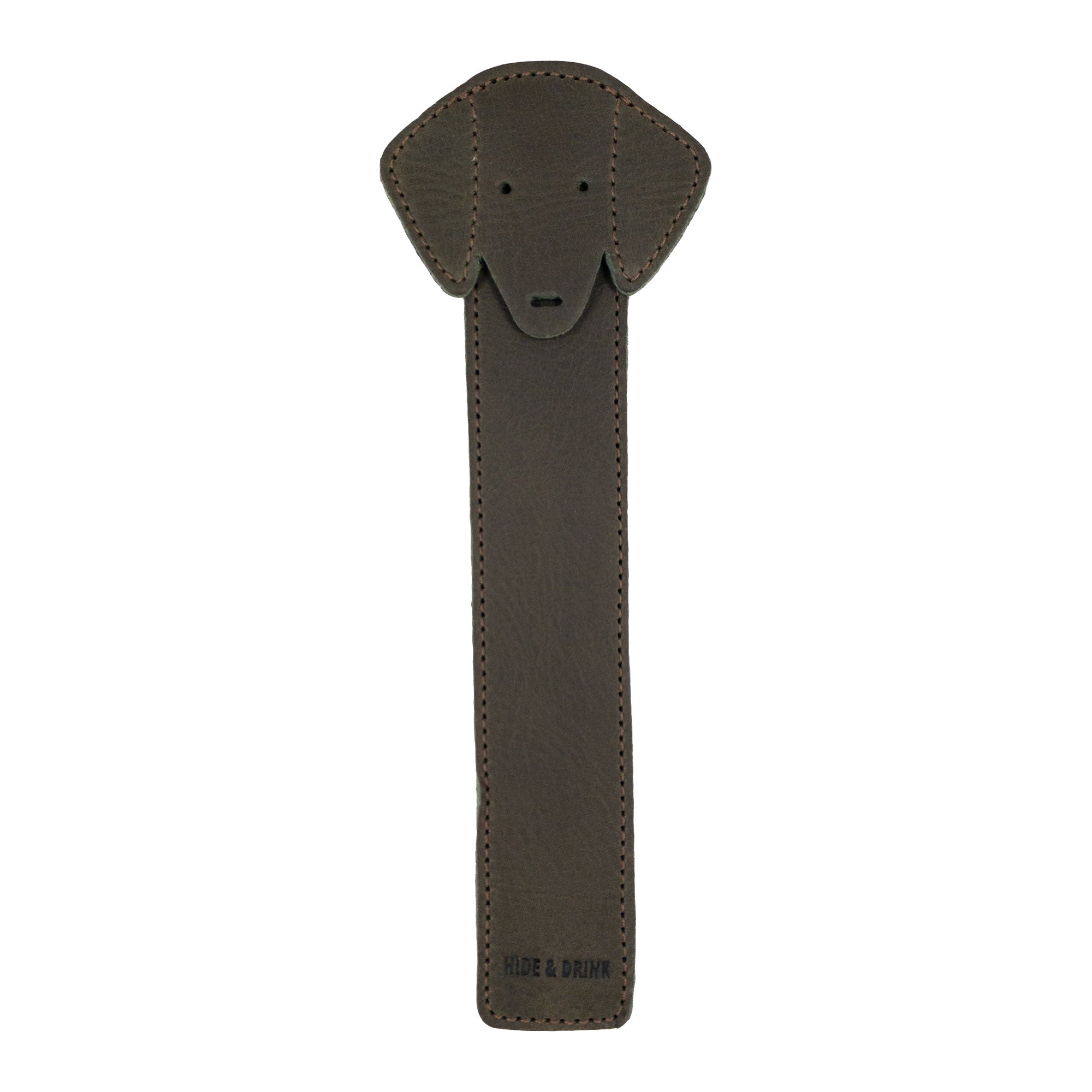 The front of Hide & Drink's brown Dog Bookmark designed in Full Grain Leather, showcasing fine details from small batch production. This artisan, handmade bookmark features fire branding inspired by La Antigua Guatemala & Oaxaca Mexico.