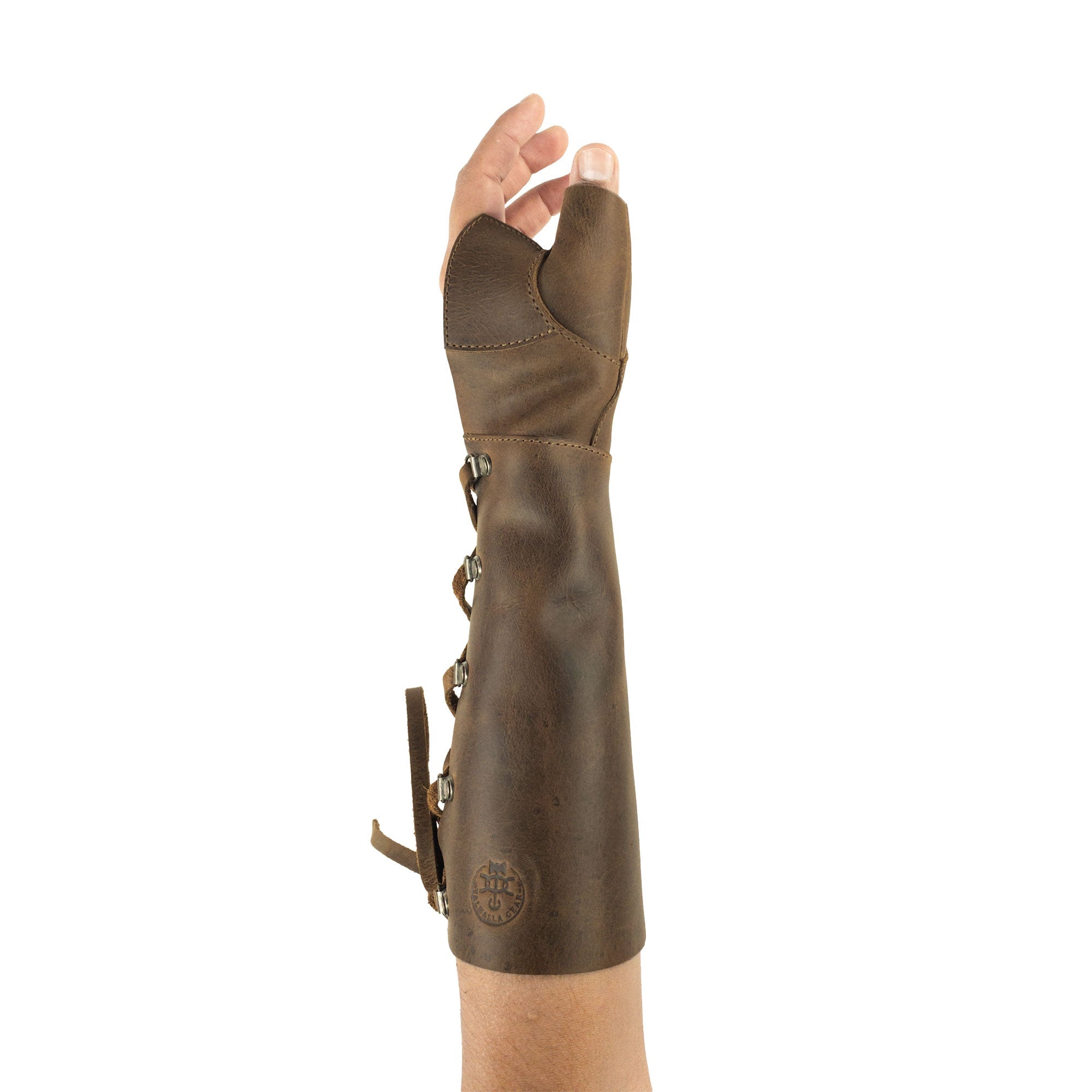 Archery Forearm Protector by Valhalla Gear showing a hand wearing the stylish arm guard, designed for bow shooting practice and training. This Full Grain Leather protector is perfect for cosplay, and reflects the craftsmanship of small batch production, hand cut and sewn, and is fire branded, making it unique and durable. Artisan handmade in La Antigua Guatemala & Oaxaca Mexico.