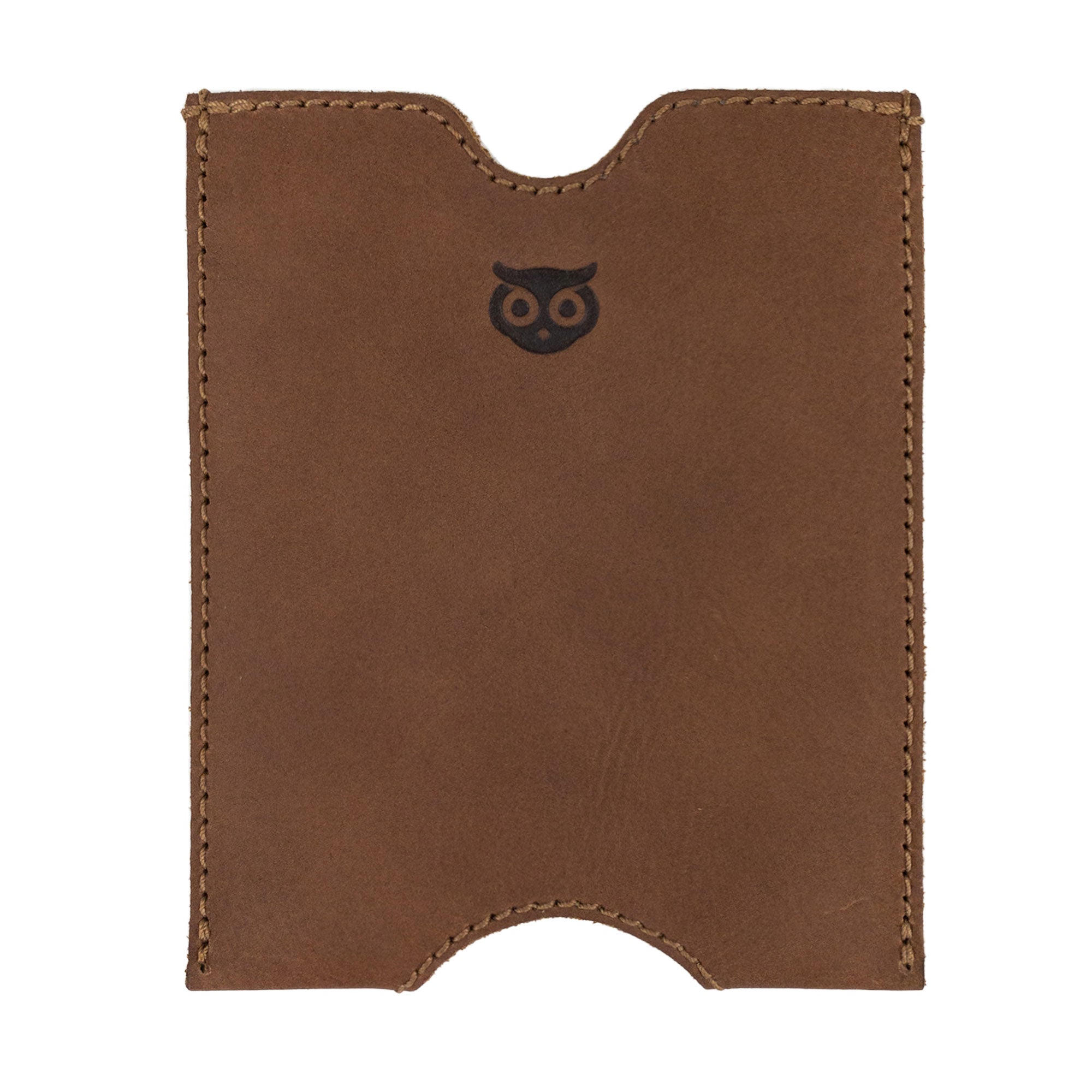 A close-up of the Hide & Drink Passport Sleeve showcasing its rich leather texture and traditional design. This full grain leather travel passport pocket sleeve is artisan crafted for long-lasting use. Features tags: Travel Passport Pocket Sleeve, Full Grain Leather, StockyardX, Small Batch Production, Hand Cut, Hand Sewn, Fire Branded, Artisan, Handmade in La Antigua Guatemala & Oaxaca Mexico.