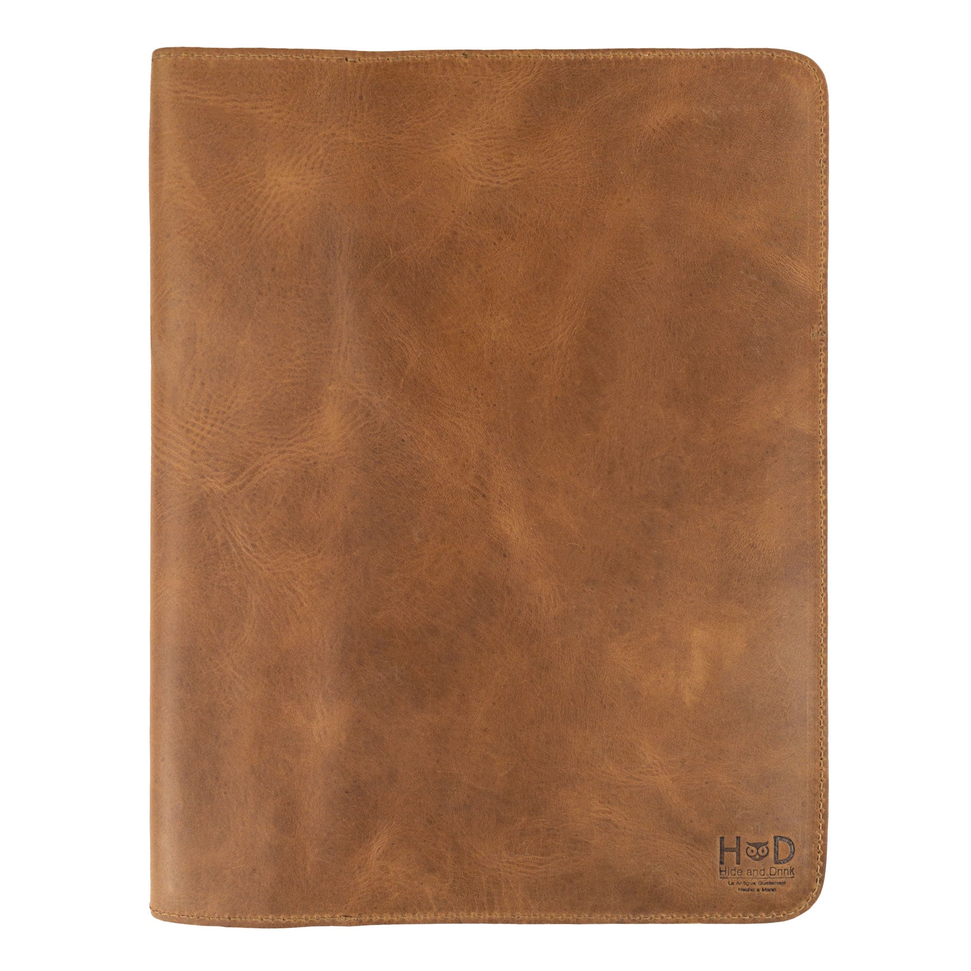 A thoughtful view of the Journal Cover for (8.5 x 11 in.) Moleskine Cahier XXL by Hide & Drink, emphasizing its handcrafted design and rich leather texture. Perfect as a genuine protector for your journal, artisan-crafted in La Antigua Guatemala & Oaxaca Mexico.