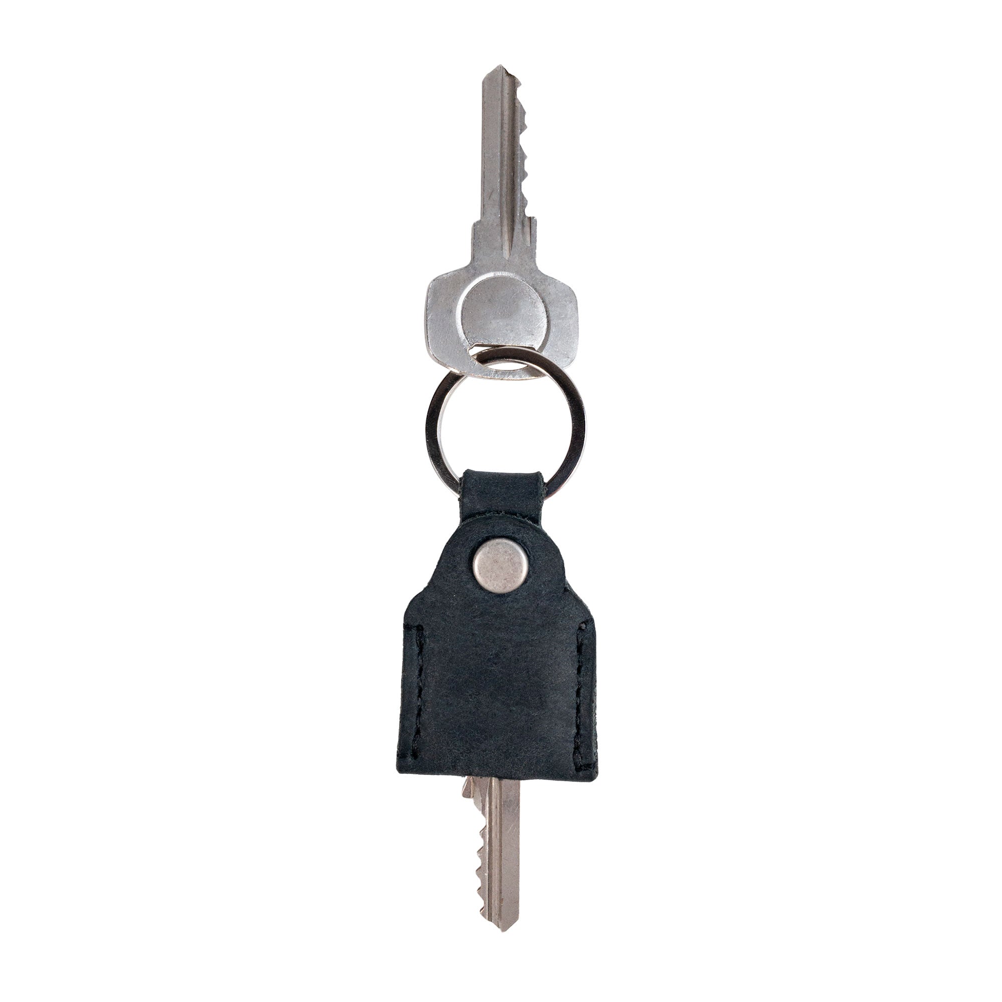 Hide & Drink Key Holder in the classic brown leather design, ideal for organizing keys. This Key Holder makes a great Keychain Organizer and emergency coin pouch, showcasing quality in Full Grain Leather. Handmade in La Antigua Guatemala & Oaxaca Mexico by skilled artisans.