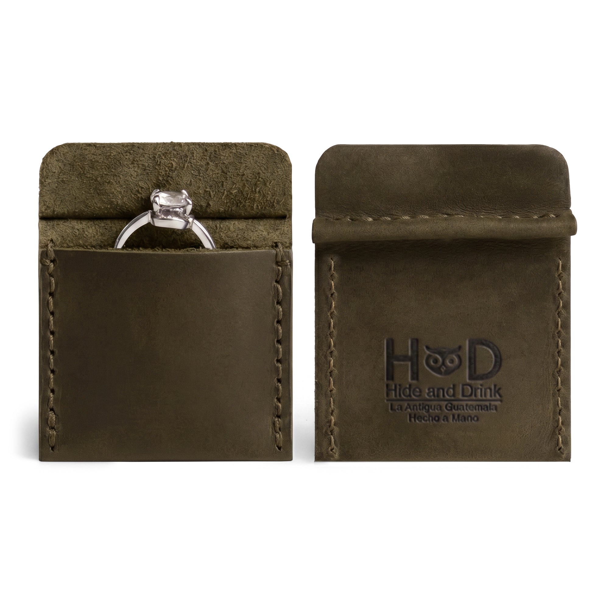 Hide & Drink Wedding Ring Case in a stylish blue hue, displaying an engagement ring. Perfect for travel, this pouch organizer for jewelry is a small batch production, handcrafted in La Antigua Guatemala & Oaxaca Mexico.