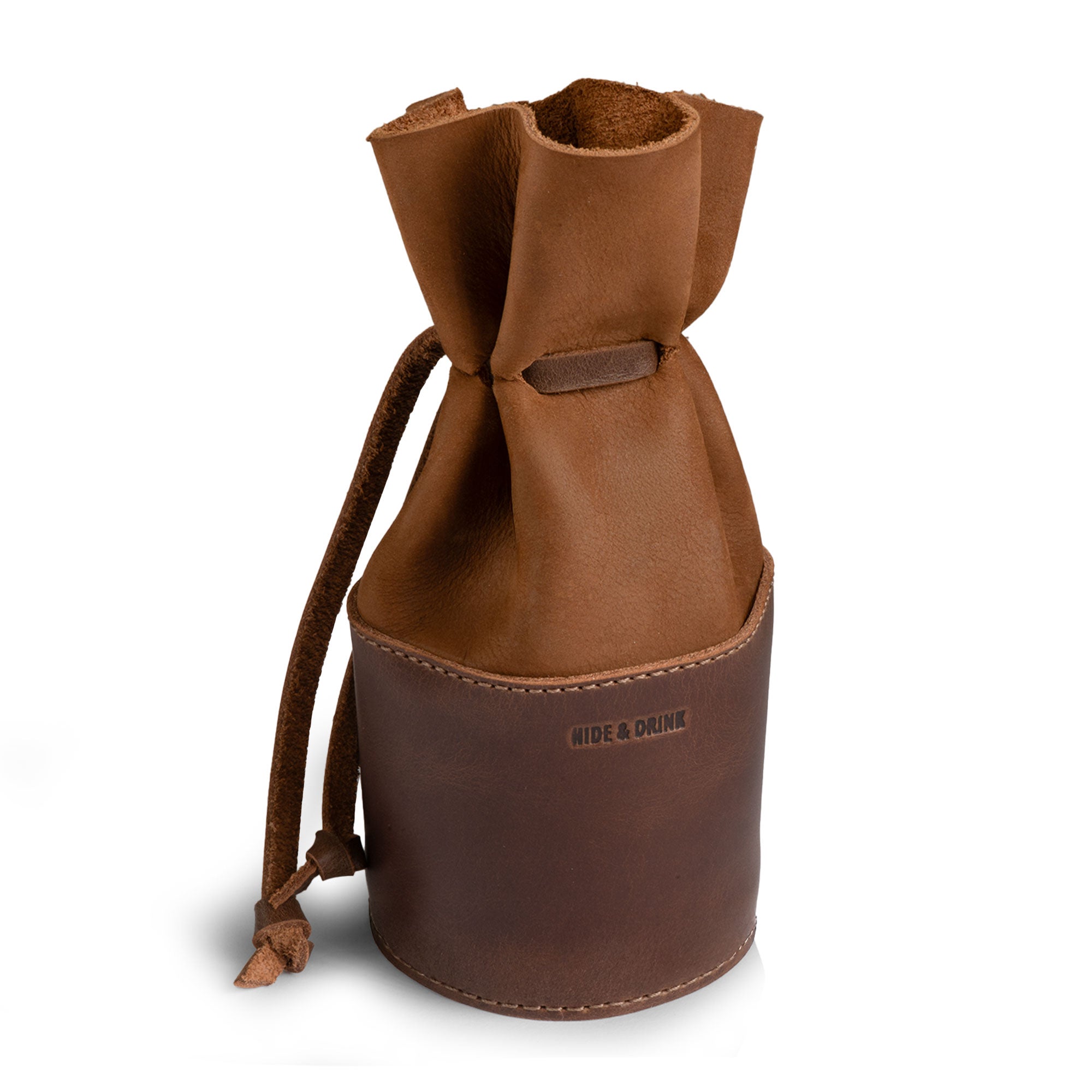 Introducing the Medieval Bucket Coin Release by Hide & Drink, a stylish and functional piggy bank bucket made from full grain leather. This coin pouch serves as a cash organizer and a cylinder case for pennies, showcasing artisan craftsmanship with hand cut and hand sewn details, handmade in La Antigua Guatemala & Oaxaca Mexico.