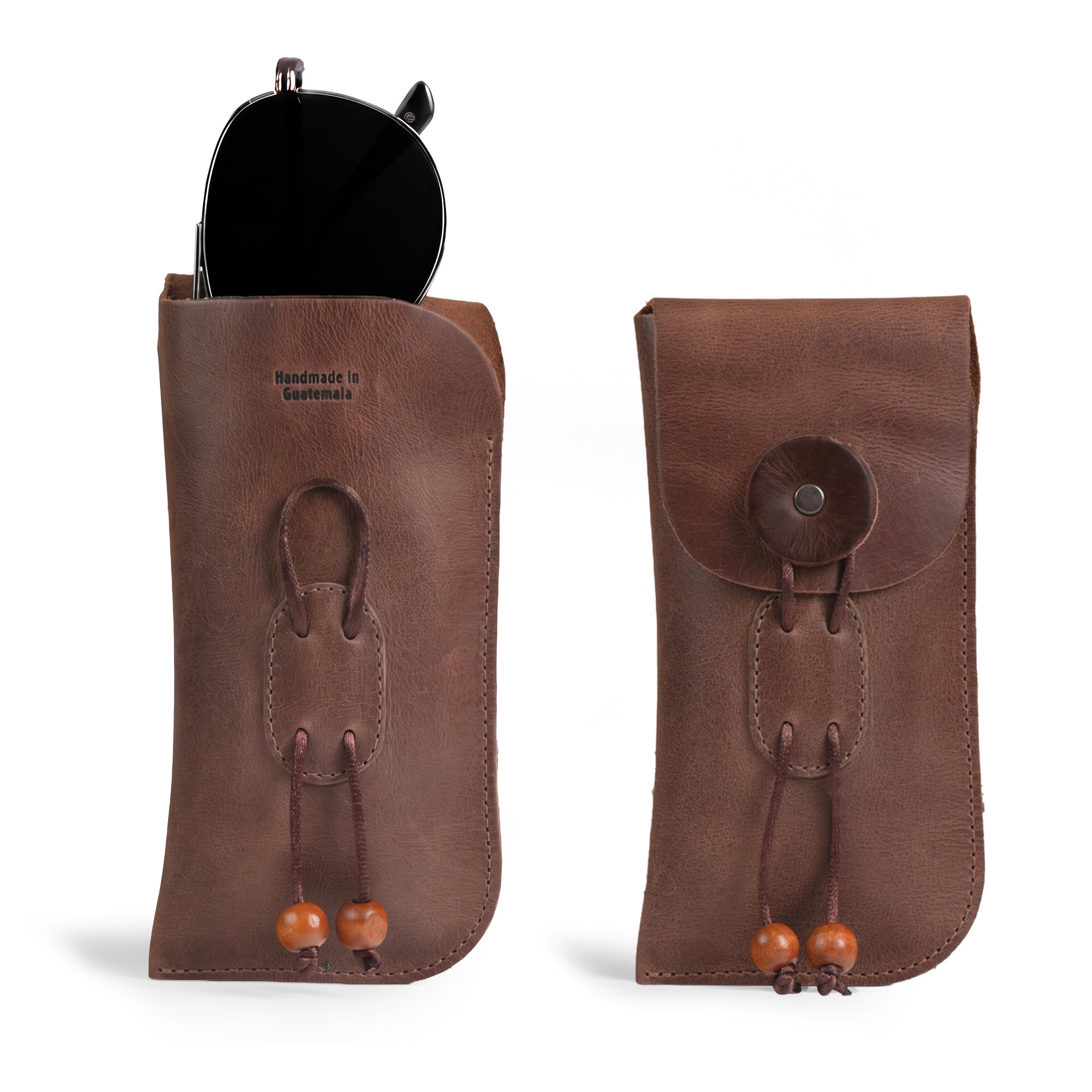 A stylish Slim Eyeglasses Case by Hide & Drink, featuring a sleek design for sunglasses or eyeglasses. Made from full grain leather, this minimalist eyewear cover reflects craftsmanship with its hand cut and hand sewn details. Perfect as a glasses pouch for travel, it showcases small batch production and artisan quality, handmade in La Antigua Guatemala & Oaxaca Mexico.