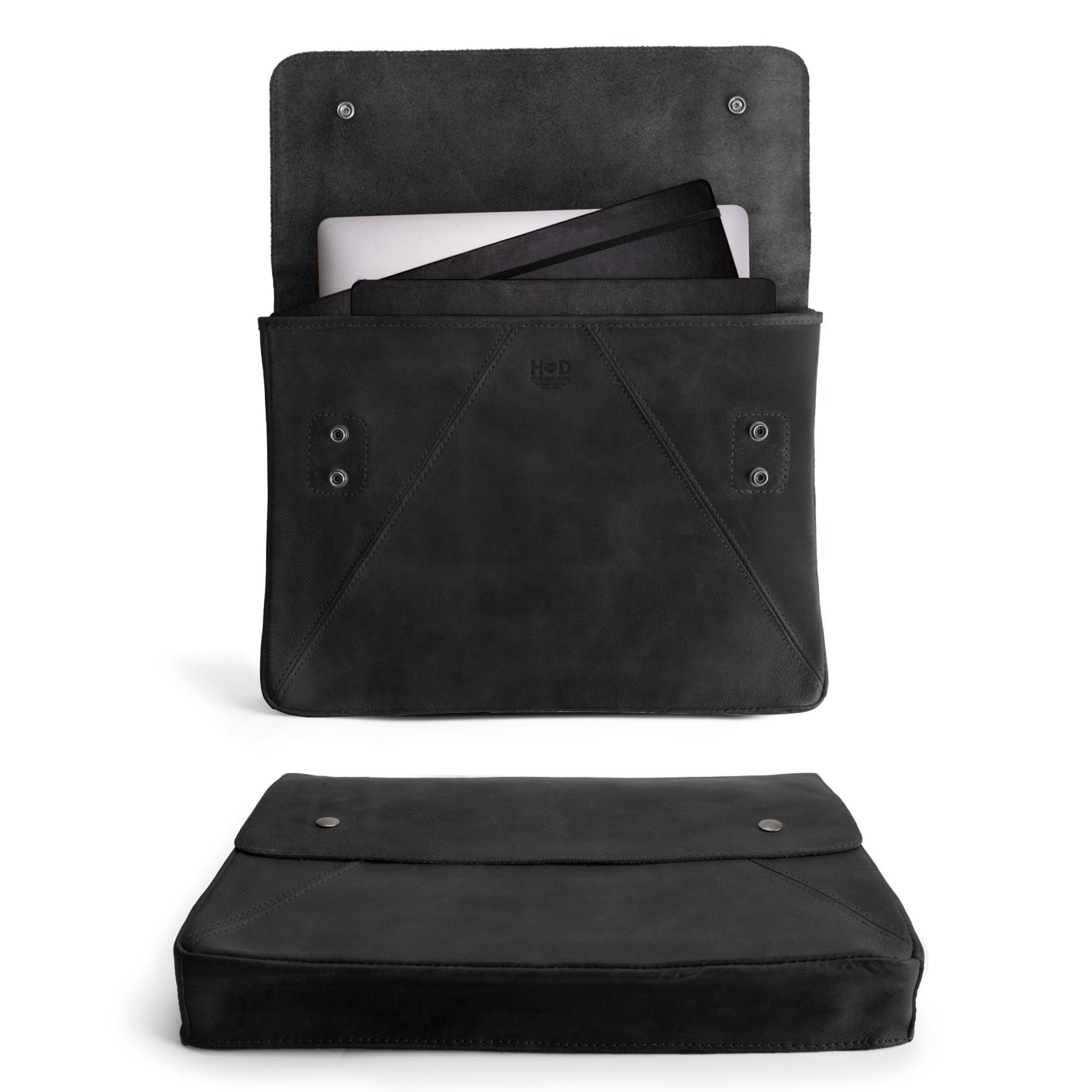 Hide & Drink's Vintage Folder Holder XL in classic black, showcasing its quality Full Grain Leather design and functional style for documents. This padfolio makes an elegant office accessory and is artisan-made in La Antigua Guatemala and Oaxaca Mexico, reflecting unique craftsmanship.