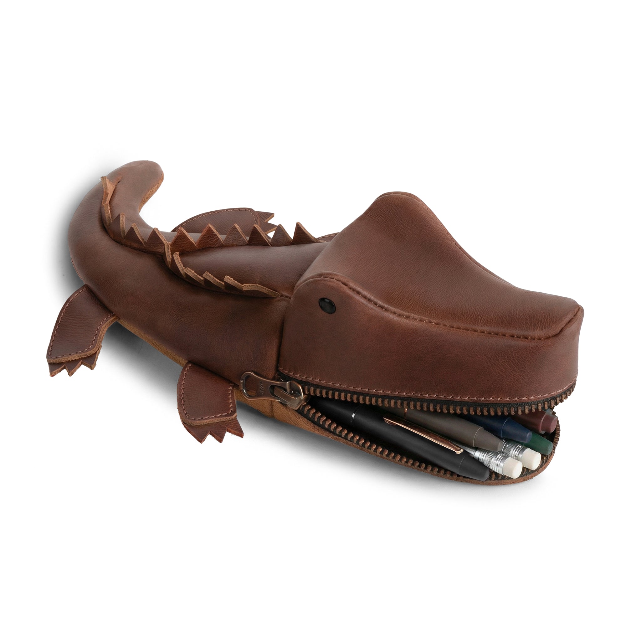 Stylish Leather Gator Pouch by Tudi Frudi, featuring a crocodile shape perfect for holding supplies. This versatile Gator Leather Pouch serves as a crocodile-shaped pencil pouch, alligator-shaped coin purse, or small charger cable holder. Made from full grain leather through small batch production, it's hand cut and hand sewn, showcasing artisan craftsmanship. Ideal as a change bag or scissors case, this unique, handmade item from La Antigua Guatemala & Oaxaca, Mexico, elevates your organization game.