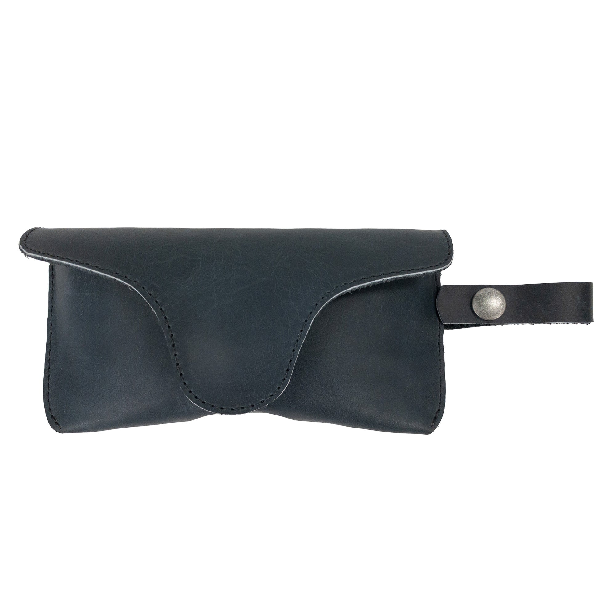 Black Eyeglasses Case with Strap by Hide & Drink featuring a sleek design. Made from full grain leather, this stylish protector for eyewear represents quality small batch production, hand cut and sewn, from La Antigua Guatemala & Oaxaca Mexico.