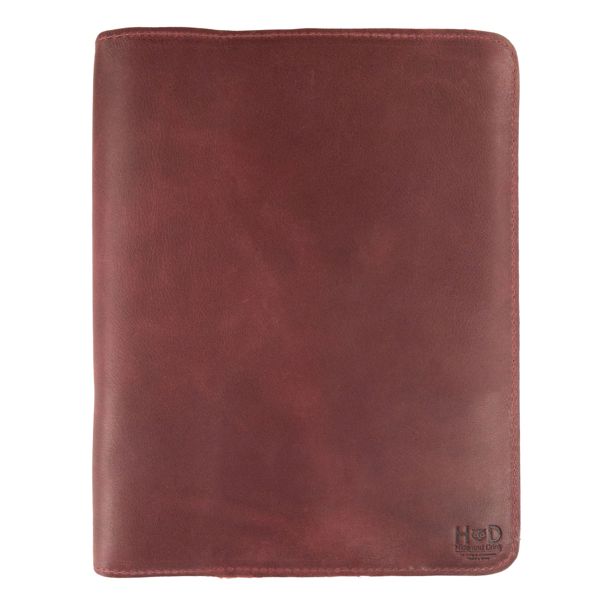 An artistic view of the Journal Cover for (8.5 x 11 in.) Moleskine Cahier XXL by Hide & Drink, showcasing the robust leather and detailed stitching. Artisan-crafted, this journal cover is the ideal accessory for protecting your notebook, made in La Antigua Guatemala & Oaxaca Mexico.