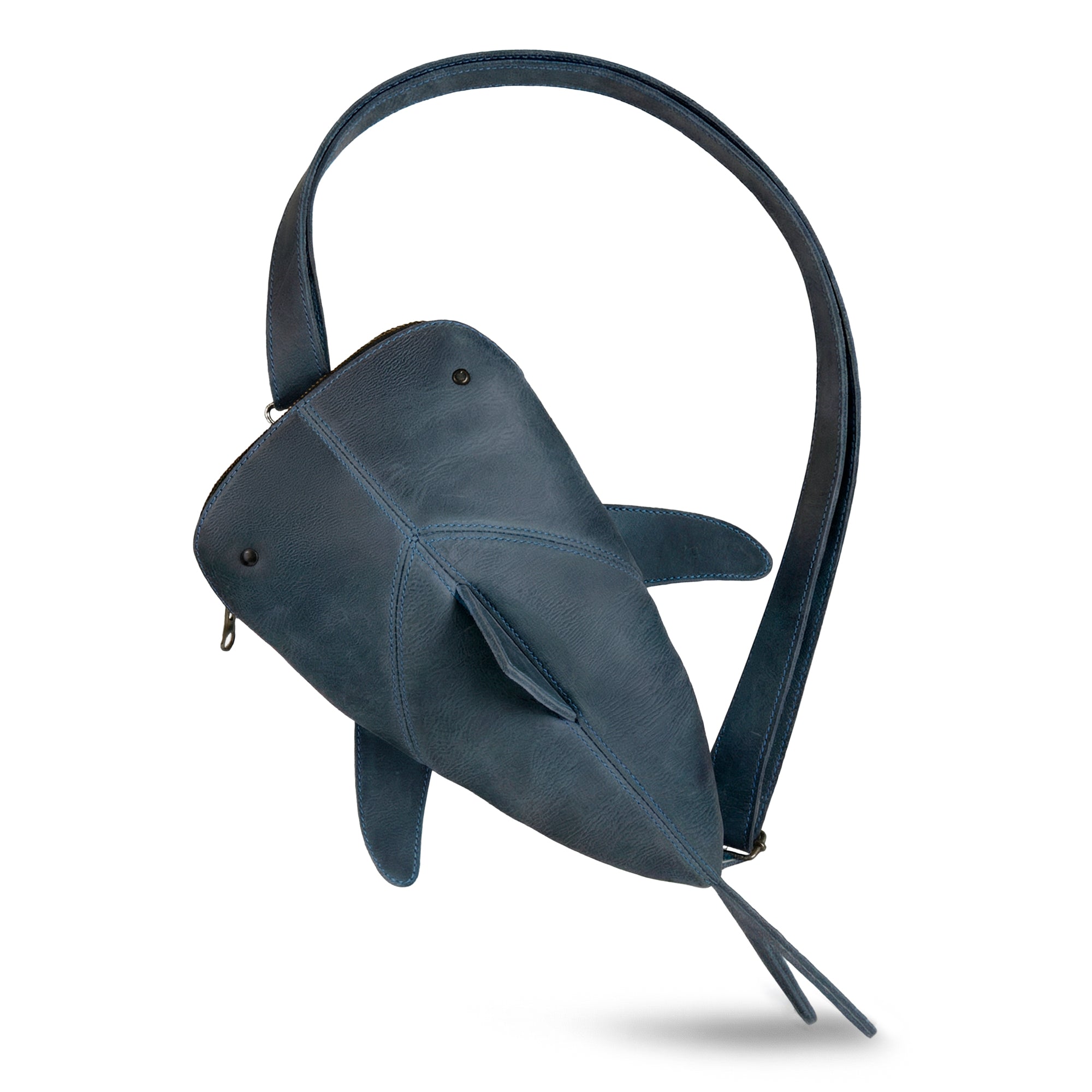 Leather Shark Crossbody Bag by Hide & Drink, showcasing a stylish shark-shaped design in premium full grain leather. This Leather Shark-Shaped Sling Bag features an adjustable strap, making it a versatile crossbody purse or messenger bag. Perfect for both men and women, suited for daily errands or outdoor adventures. Handmade by skilled artisans in La Antigua Guatemala & Oaxaca Mexico, ensuring a unique, high-quality piece. Ideal for travel and casual outings.