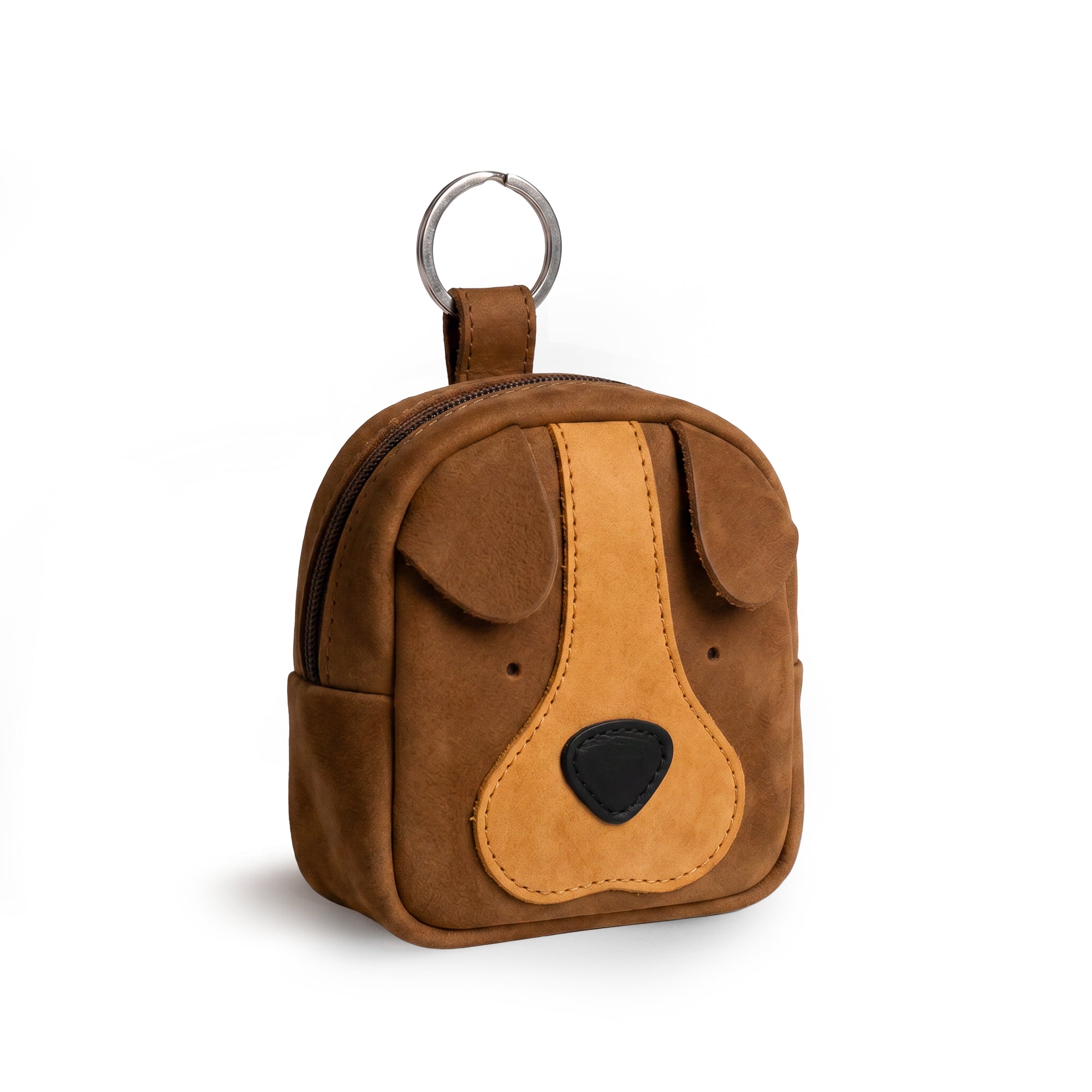 The Pouty Pup Mini Pack by Hide & Drink is a charming brown suede leather coin purse designed to resemble a dog, perfect for a small backpack or wallet. Ideal as an SD card holder or USB organizer, it's handmade in La Antigua Guatemala, combining artisan craftsmanship with small batch production for a unique touch.