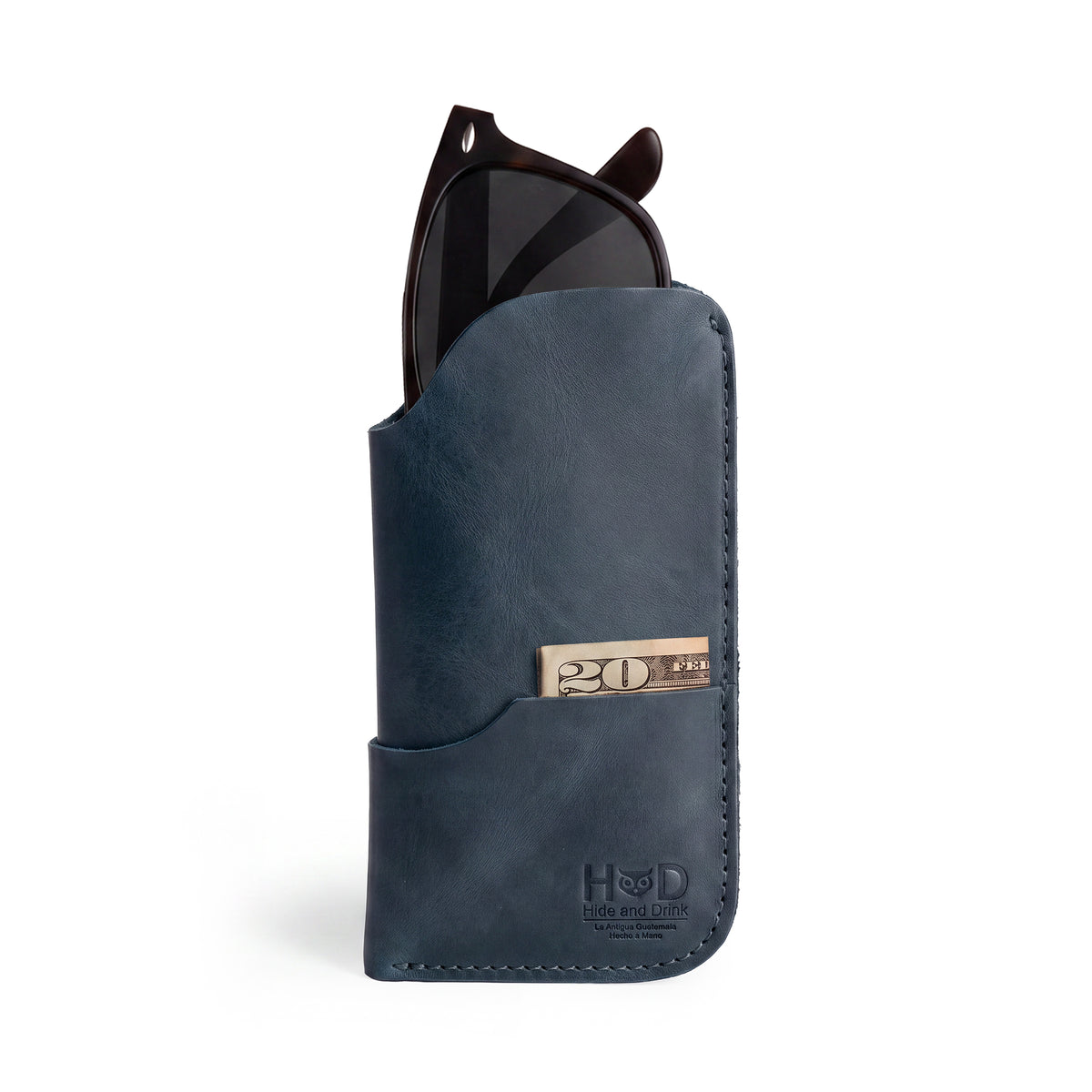 The Hide & Drink Sunglass Case & Wallet showcased beautifully, offering practicality and elegance. This Rustic Sunglasses Case & Wallet is crafted from Full Grain Leather, making it a chic glasses protector for travel, produced with care in La Antigua Guatemala & Oaxaca Mexico.
