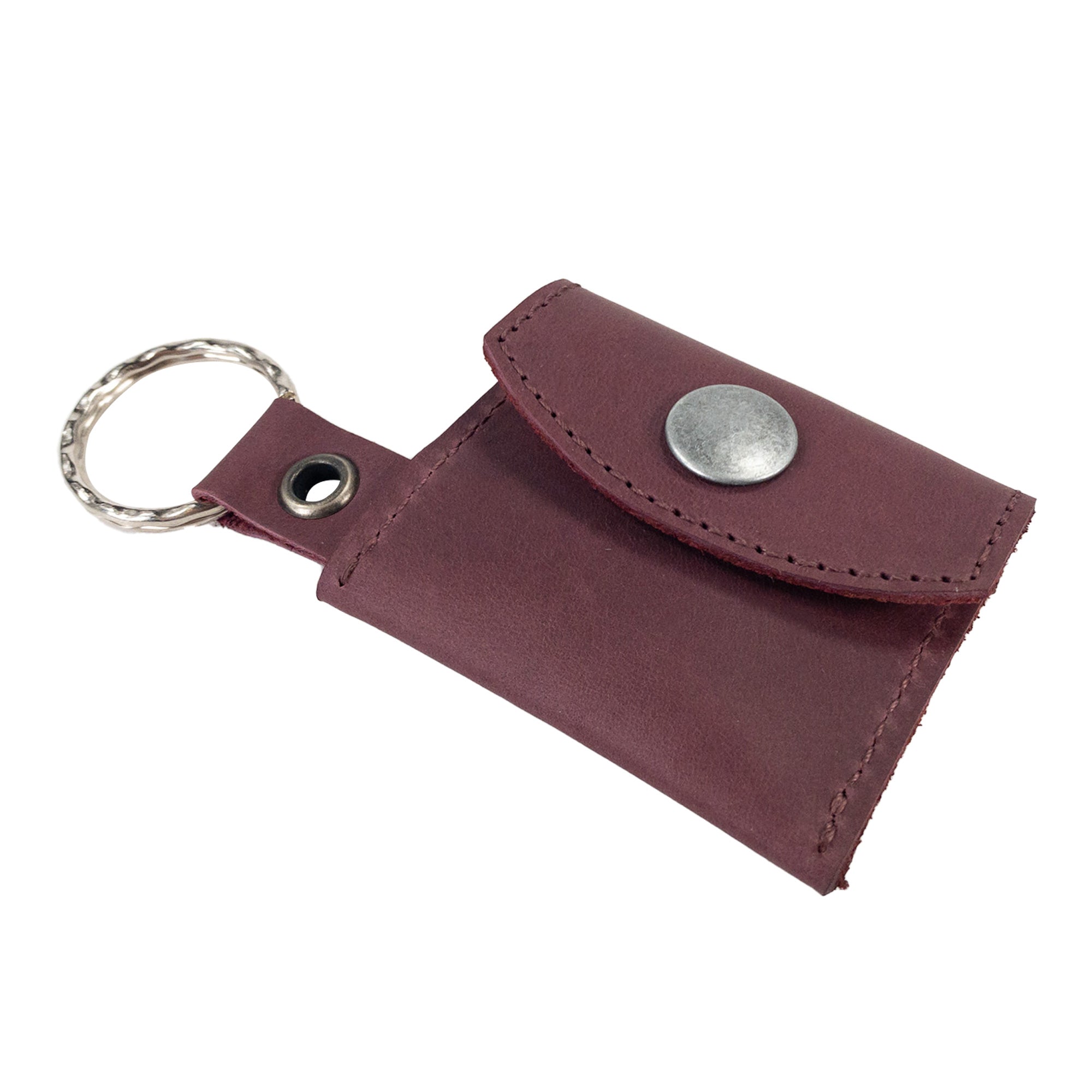 Handmade Tiny Coin Holder Keychain by Hide & Drink is perfect for carrying essentials, highlighted by its quality Full Grain Leather. This Tiny Coin Holder embodies small batch production and skilled artisan craftsmanship.