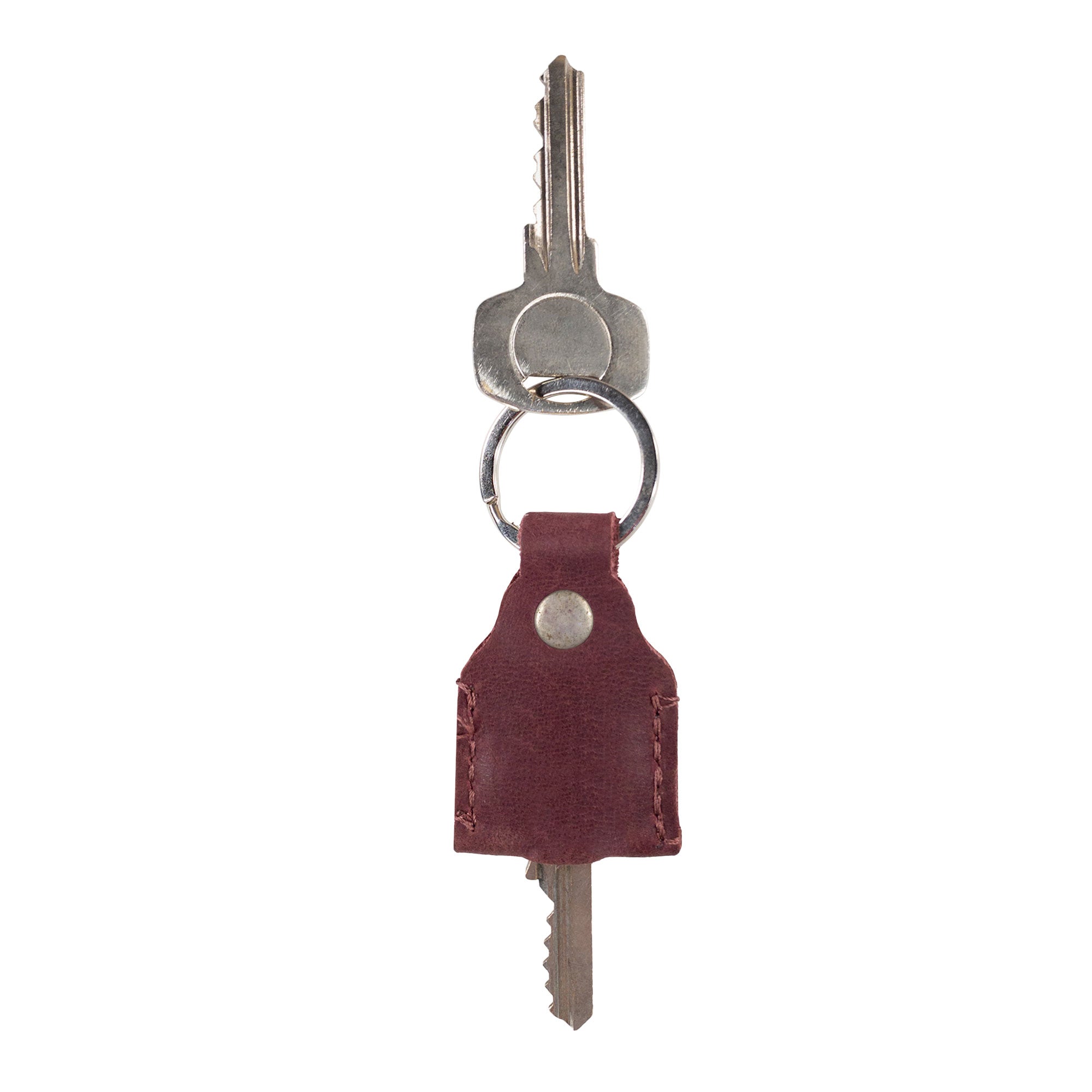 Hide & Drink Key Holder in rich burgundy leather, demonstrating exceptional craftsmanship. This stylish Key Holder serves as a Keychain Organizer and emergency coin pouch, an essential pocket accessory made from Full Grain Leather. Artisan-crafted in La Antigua Guatemala & Oaxaca Mexico.